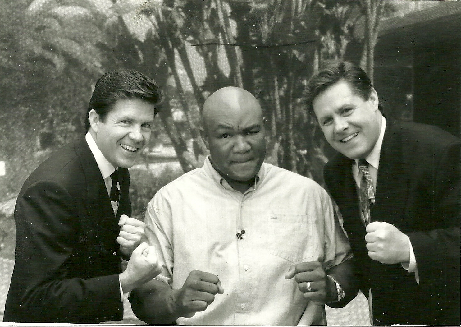 Butch McCain, former Heavyweight Champion George Foreman and Ben McCain posing after interview.