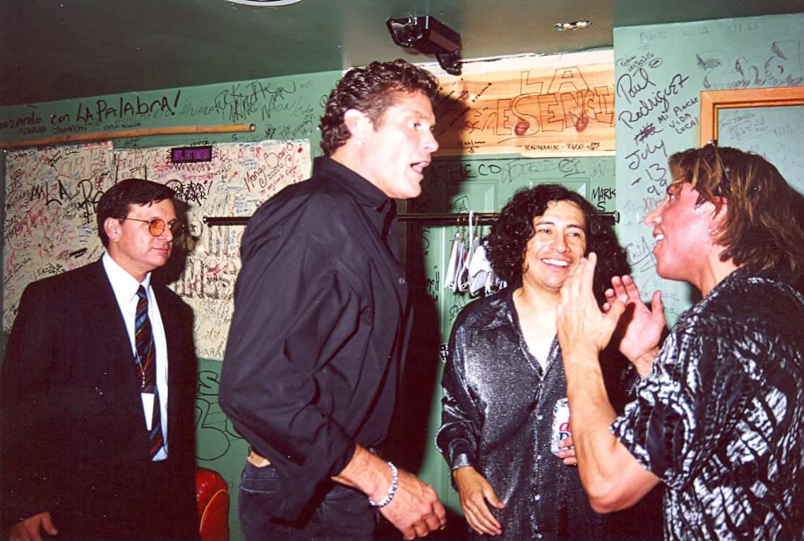 Kim Richards looks on as David Hasselhoff congratulates RENEGADE's Danny David Flores and Kenny Marquez backstage at The Conga Room moments after Hasselhoff presented the Richards produced group with platinum awards for sales in excess of 30 million worldwide