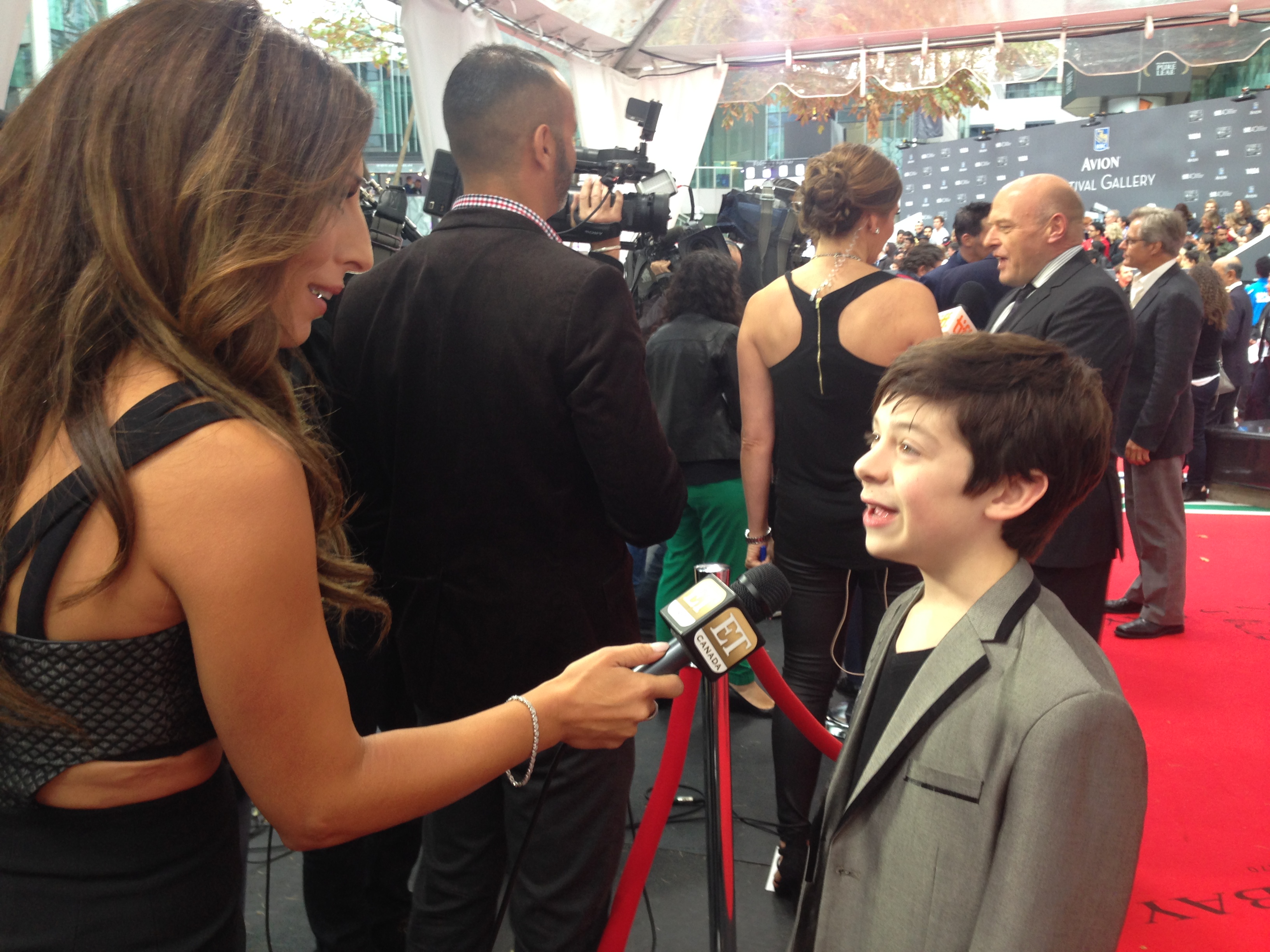 Peter DaCunha being interviewed by ET Canada at Toronto International Film Festival's red carpet for 