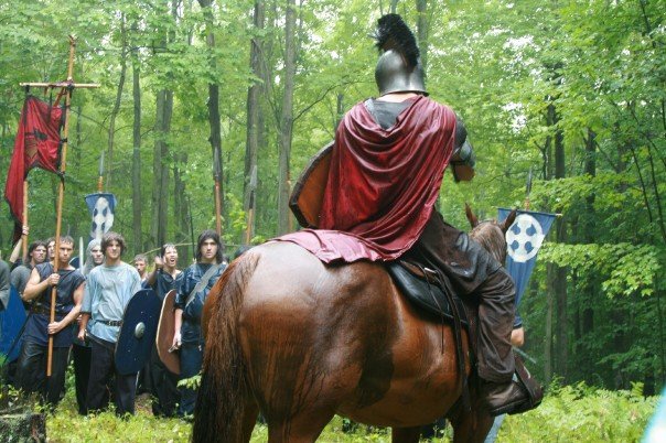 Aaron Burns on horseback, filming Pendragon: Sword of his Father