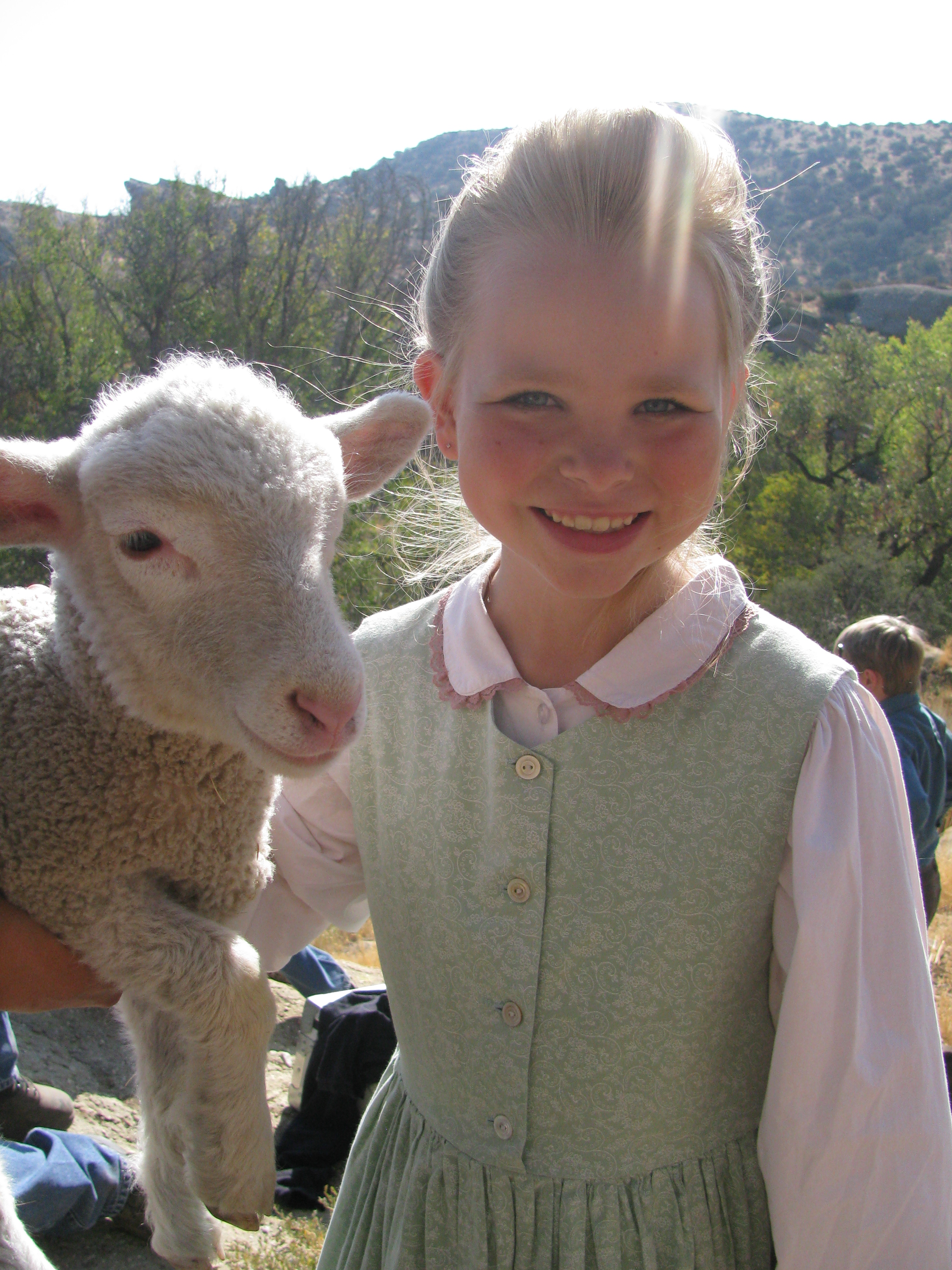 Amber with lamb on set of 