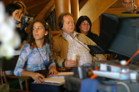 John-Roger watches on the Monitor the scenes on set of 