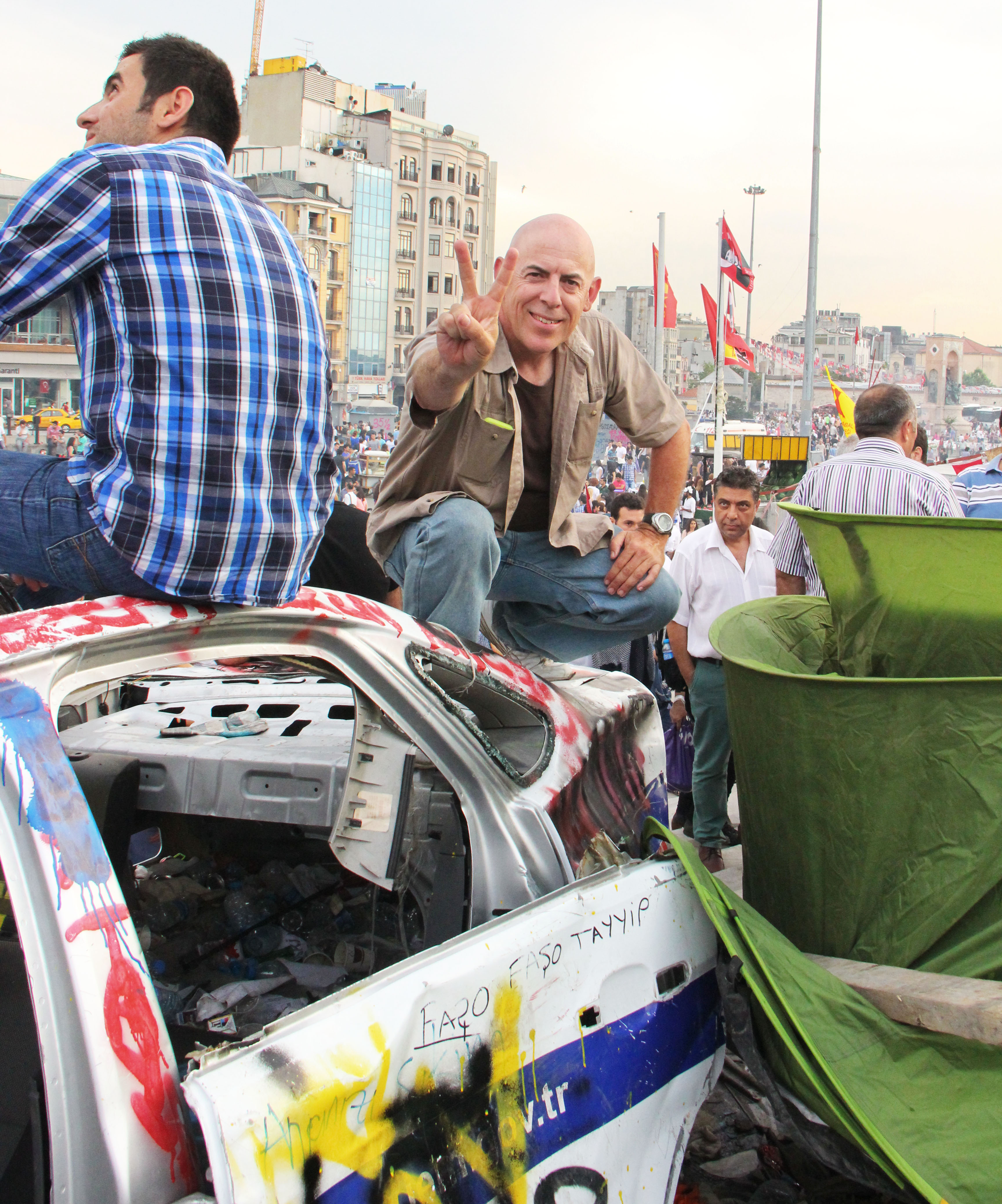 Preaching peace from the top of a police car in Taksim Square, Istanbul, June 15, 2013. Glenn photographed the protests and police crackdown. (See his Facebook page.)