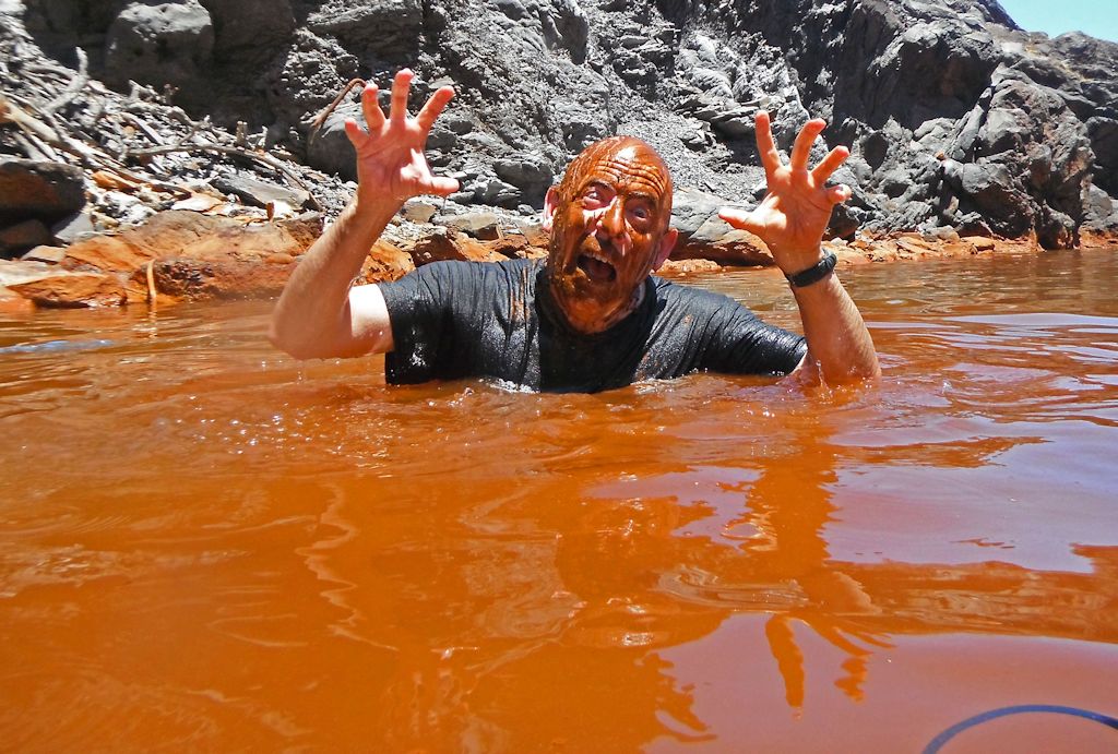 The Zombie from Atlantis emerges from the Palea Kameni Hot Spring in Santorini, Greece. June 2013.