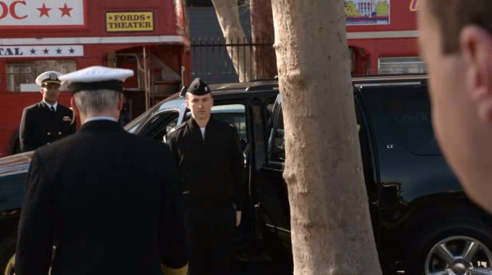 Brenden (center) waits for Admiral McGee during an episode on NCIS