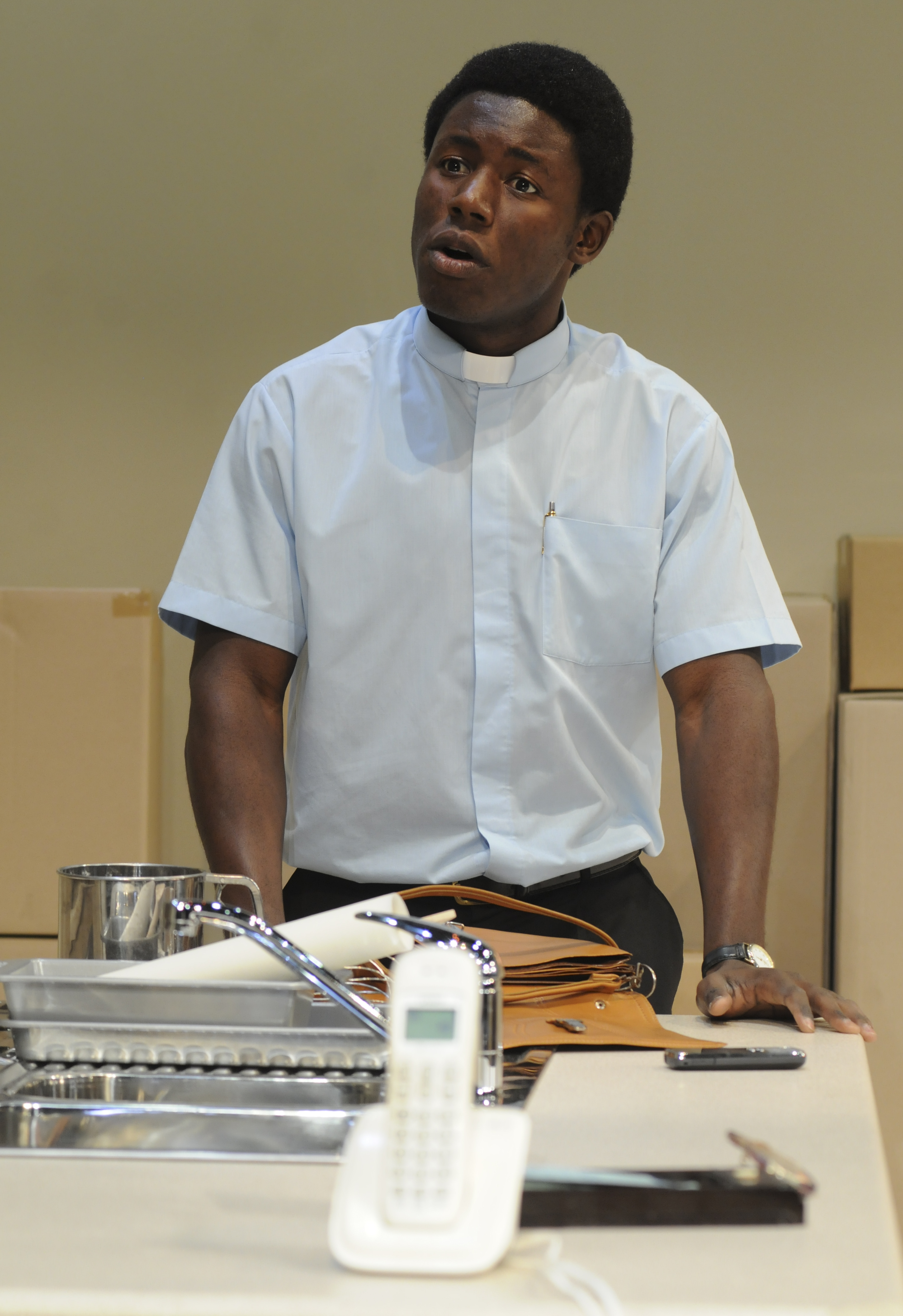 Pacharo Mzembe as Father Ezikiel [Gwen in Purgatory]