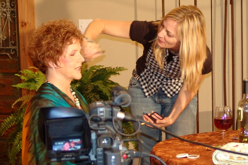 Christoff's Gilded Lily touches up Carla Daws' makeup for the wine bar scene in Wine Bar of the Mind