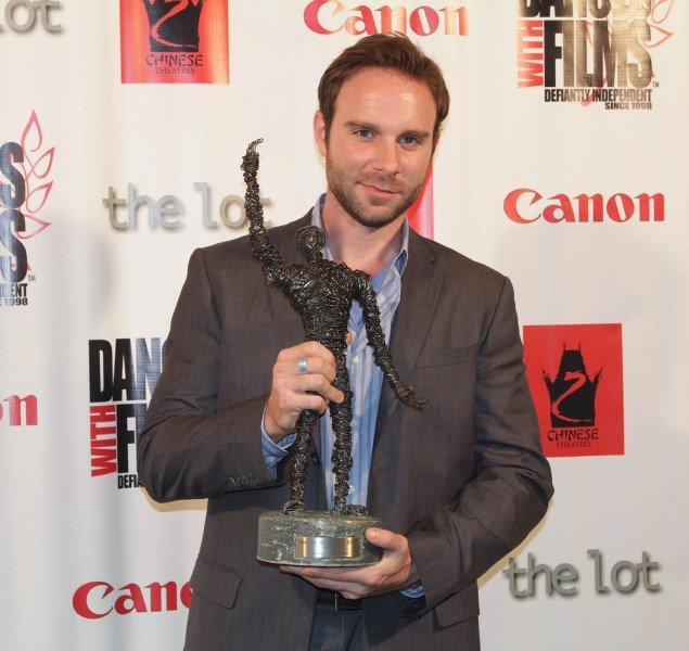 Actor Bryan Kaplan holds Grand Jury Award for the film Fray