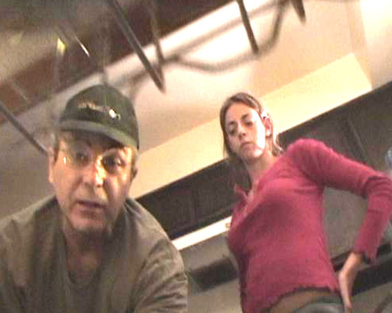 Jon Raymond setting a dishwasher cam with Rachel Germaine on the set of Eight-ish