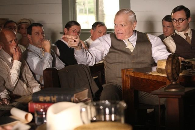 Clarence Darrow (Brian Dennehy) fires off a comment in defense of John T. Scopes (Jamie Kolacki) at the Scopes Monkey Trial.