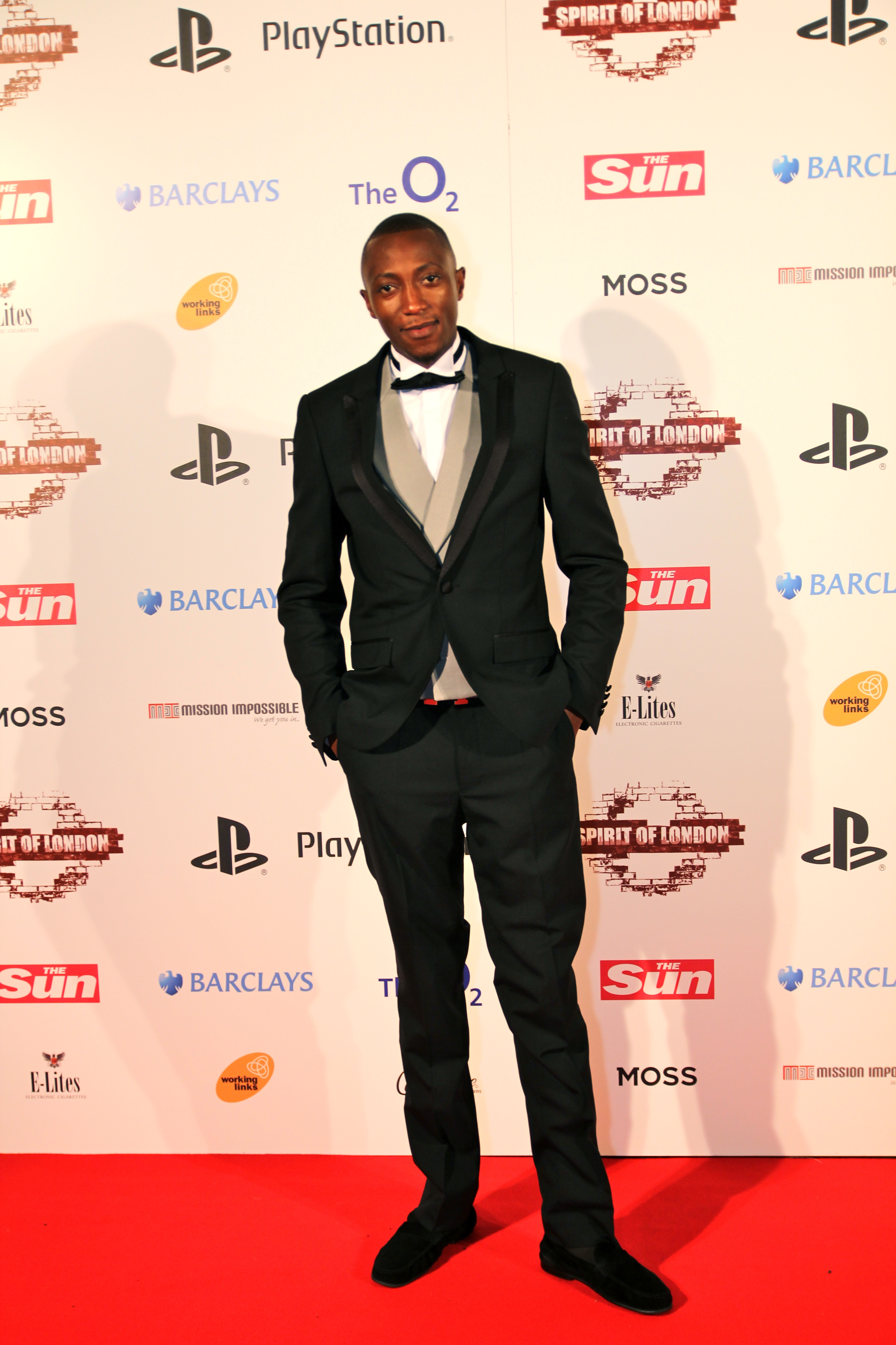 Emmanuel Akintunde on the red carpet at Spirit of London Awards, London O2, 2012