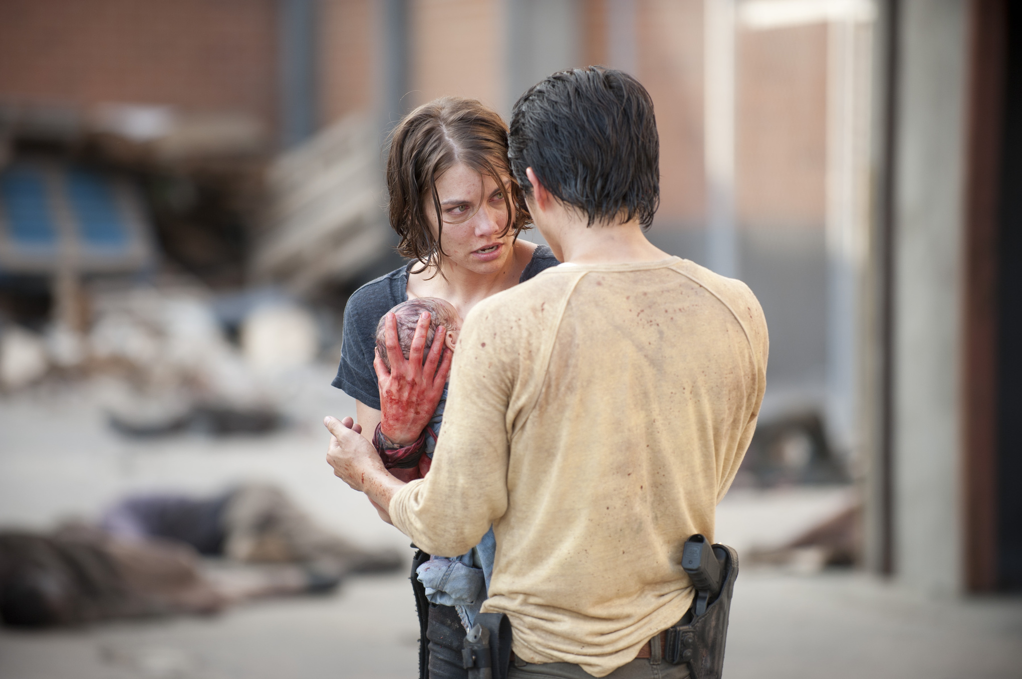 Still of Lauren Cohan and Steven Yeun in Vaiksciojantys negyveliai (2010)