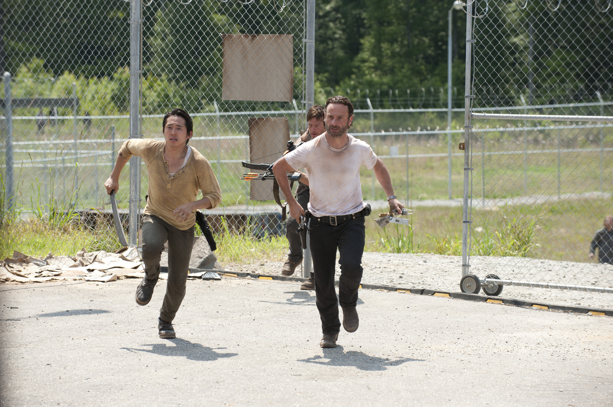 Still of Norman Reedus, Andrew Lincoln and Steven Yeun in Vaiksciojantys negyveliai: Killer Within (2012)