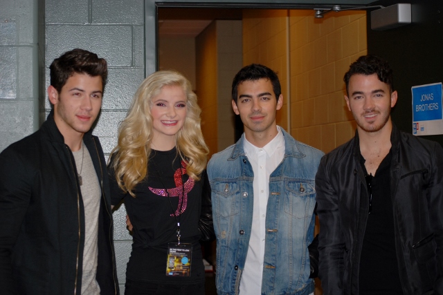 Michelle Bergh with co-presentrs, The Jonas Brothers, at We Day MN.