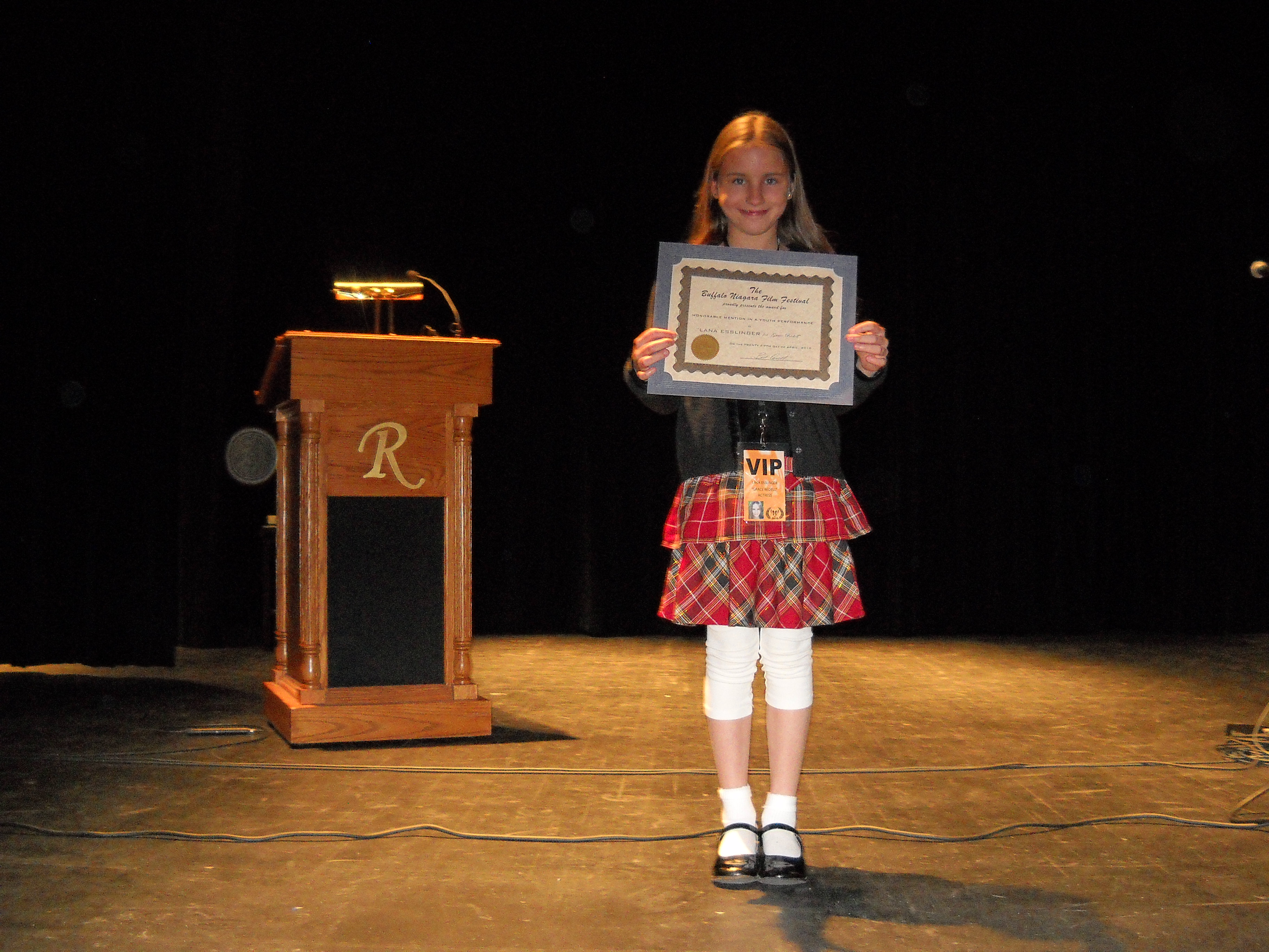 LANA ESSLINGER on stage at the Riviera Theatre accepting her Buffalo/Niagara Film Festival's Youth Performance Award presented to her, for her portrayal of Grace Bedell.