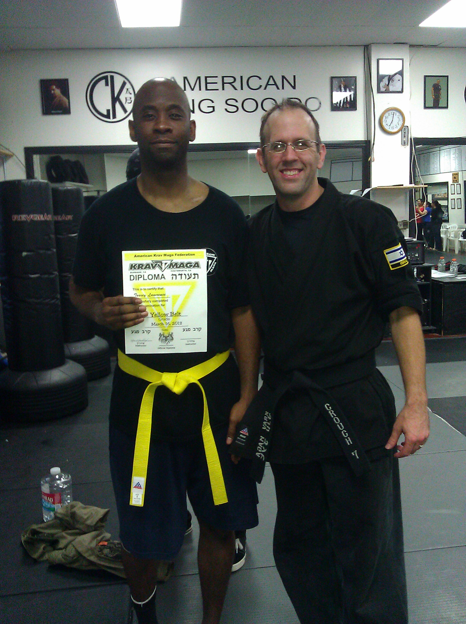 Torrey recieves his yellow belt in Krav Maga in March 2013 with his instrcutor Chris Crouch.