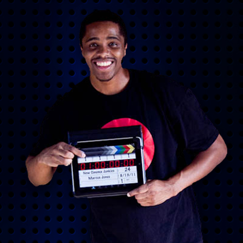 Marcus Jones Hold and ipad with the Movie Slate App.