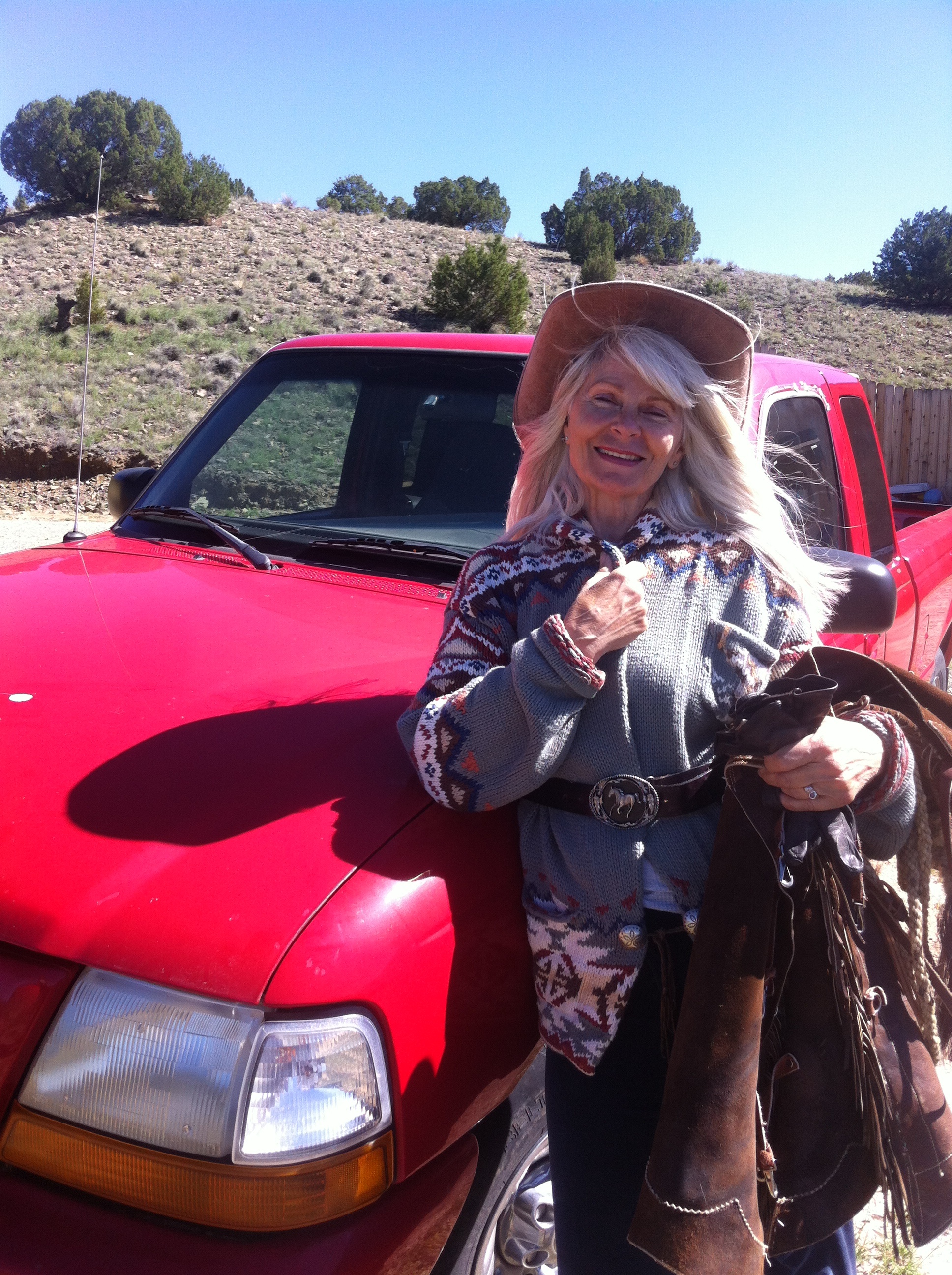 cowgirl with lil' red truck