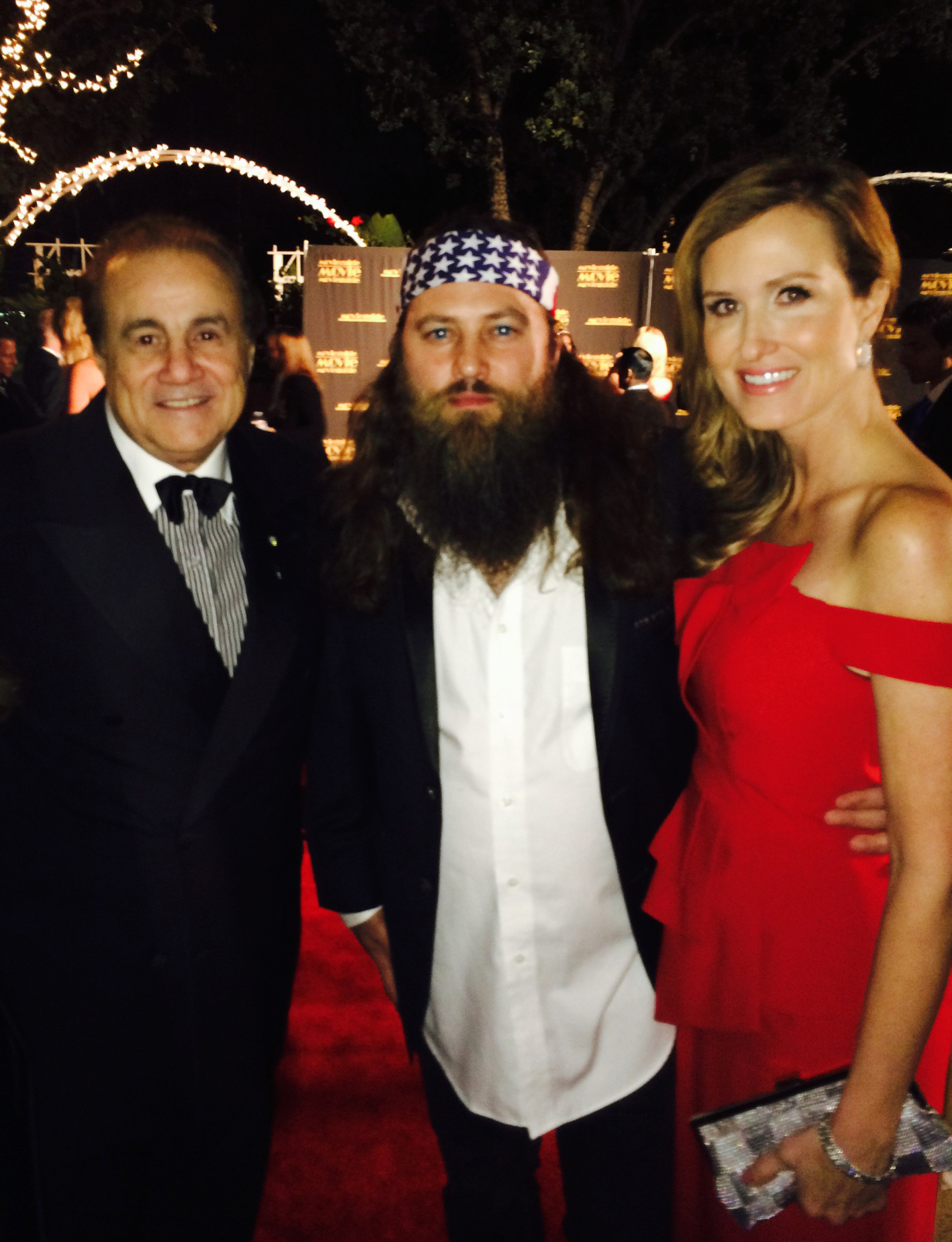 Executive Producer Larry Thompson (L) with Willie Robertson (Center) and Korie Robertson (R) at the 22nd Annual Movieguide Awards held at the Sierra Ballroom at the Universal Hilton, Universal City, CA on February 7, 2014.