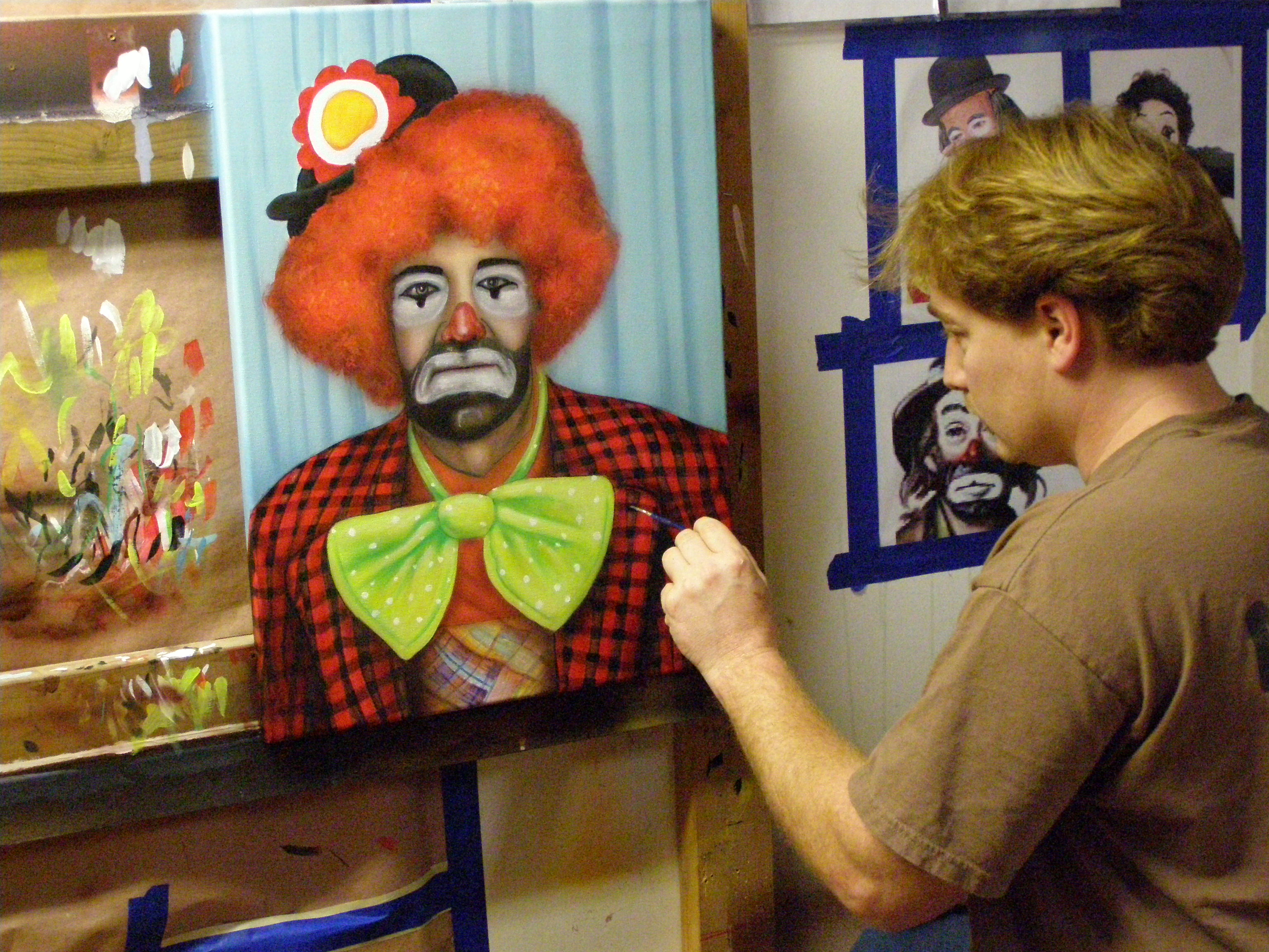 Kevin painting a portrait of the character 