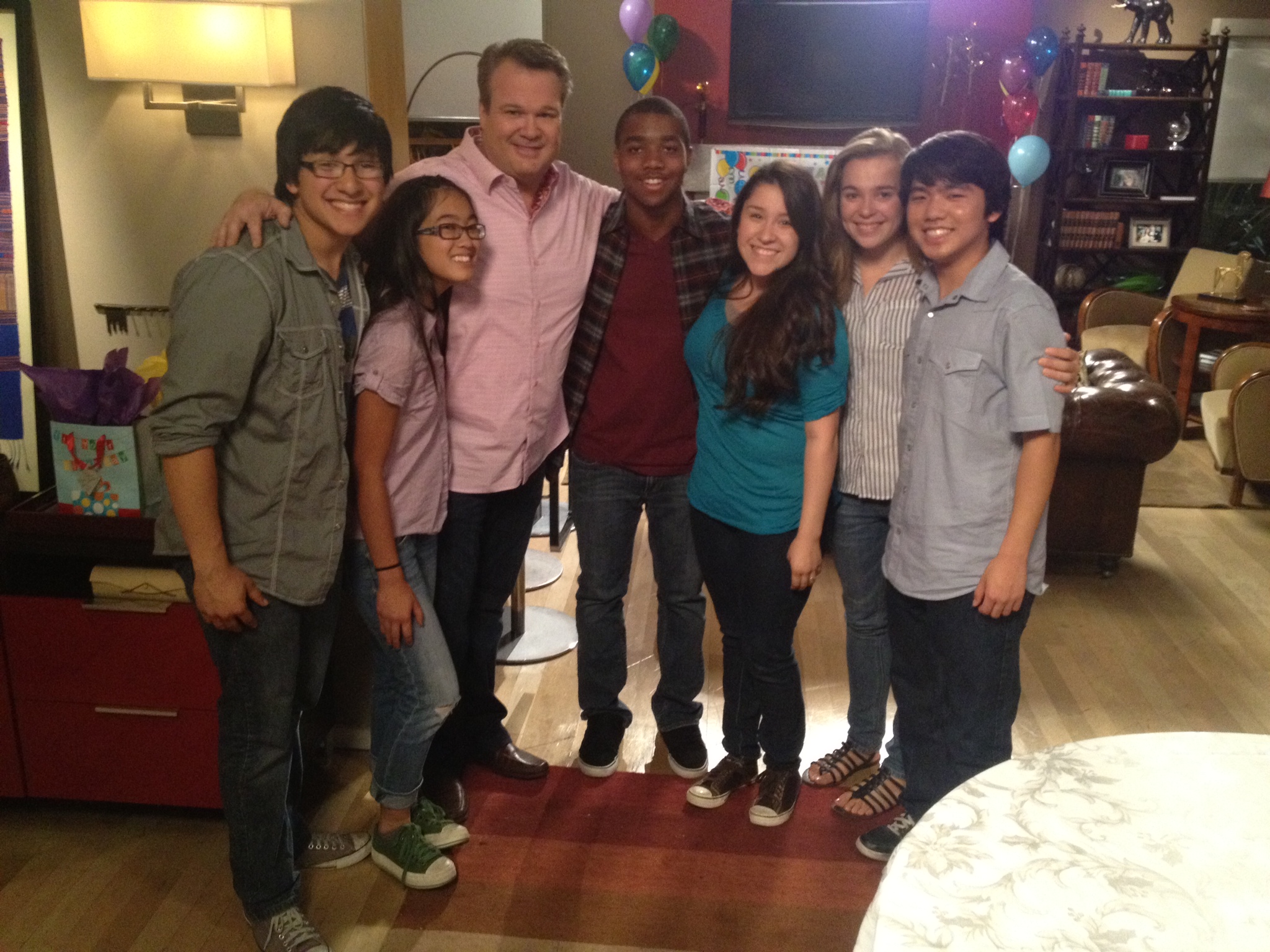 Julian Xavier with Eric Stonestreet on the set of 