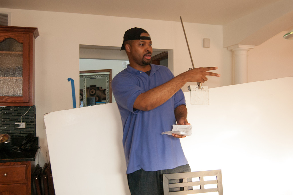 At 6'6 tall Film Director Christopher Nolen directing a scene in 