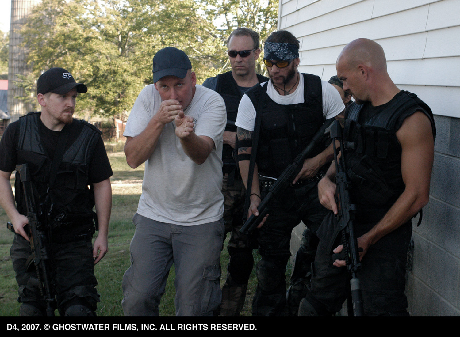 Michael Henderson instructs the cast on weapons handling and team movement during pre-production training.