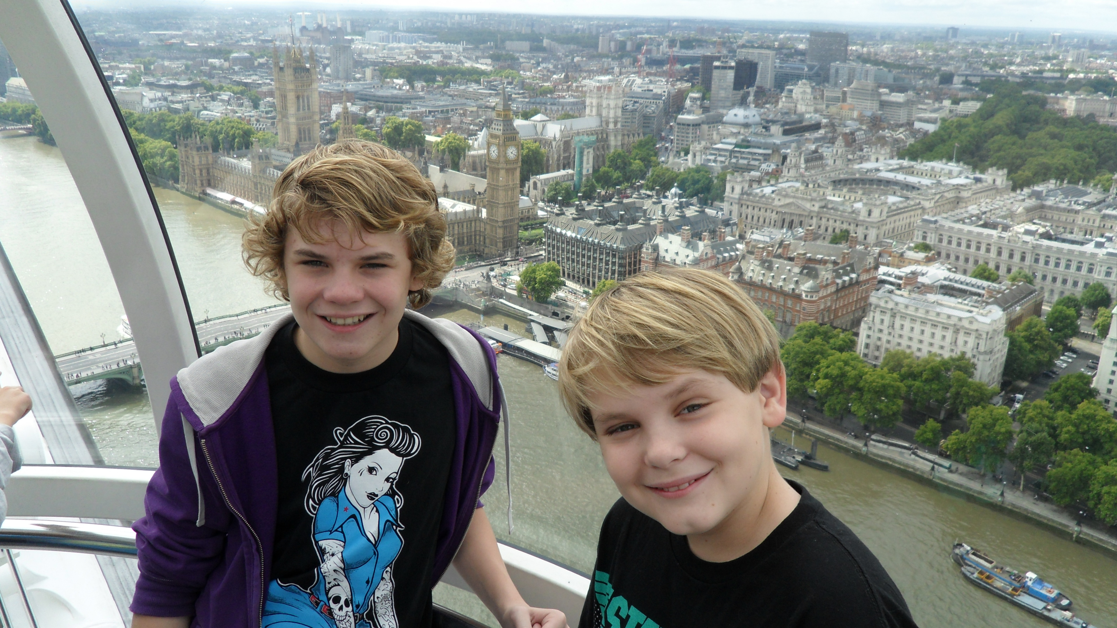 Ryan Hartwig and Reese Hartwig on the Eye of London with Big Ben in the background while on a break from shooting 