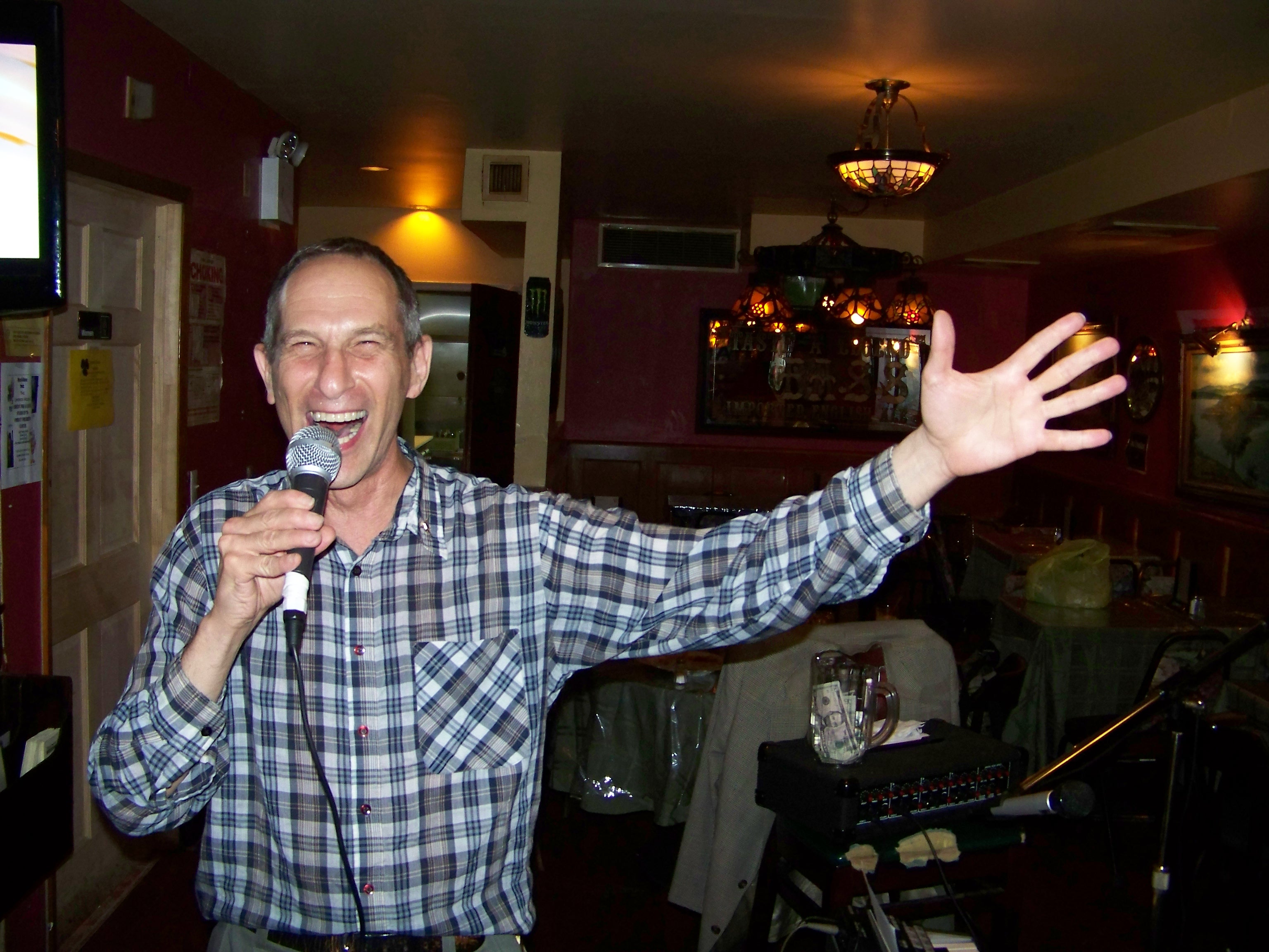 (date posted). Phillip W. Weiss singing at a restaurant in New York City, May 2009.