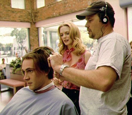 Director James B. Rogers shows Heather Graham how to give a bad haircut