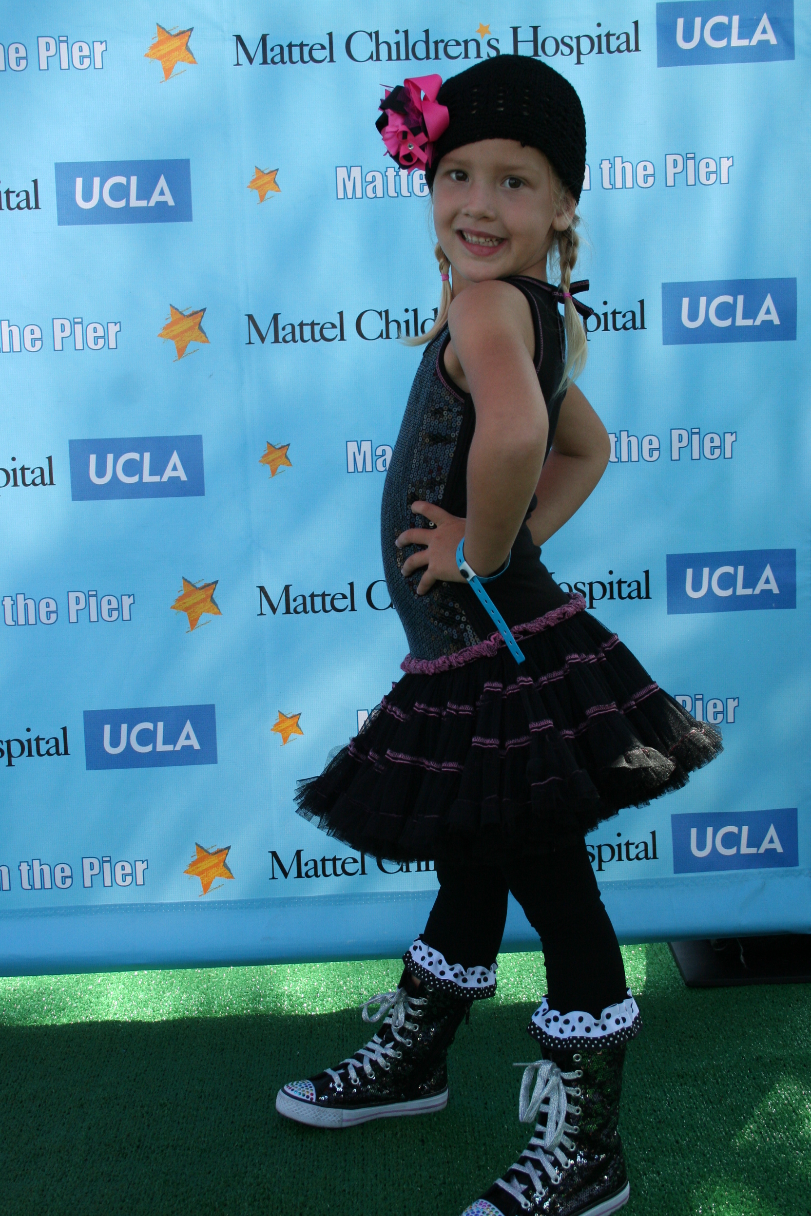 Natalia wearing Ooh! La,La! Couture and Bon Bon Cupcake Leggings on the carpet at the 2011 Mattel Party on the Pier!