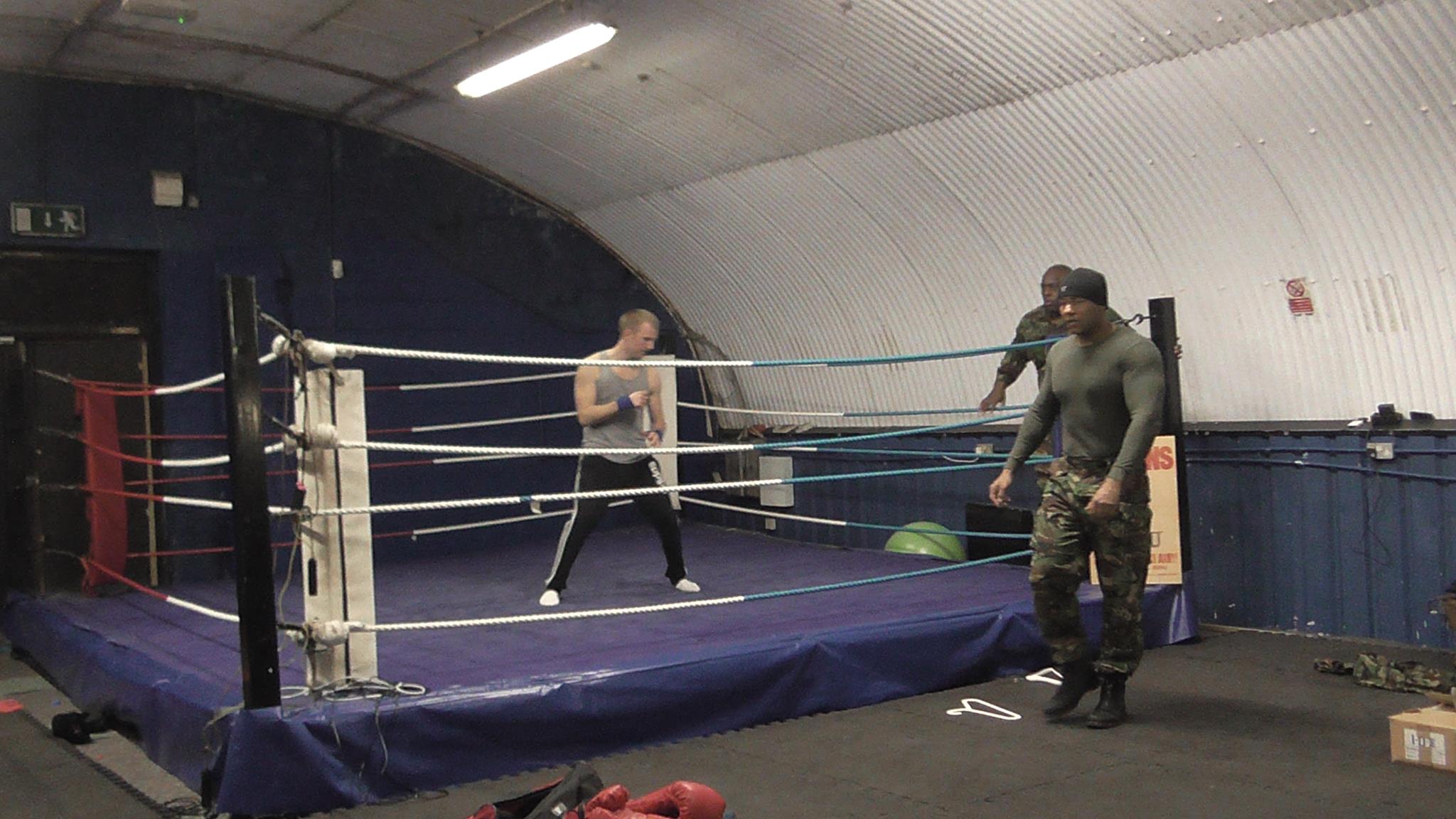 Martin J. Thomas (far right) fight training on the Set of Service Man.