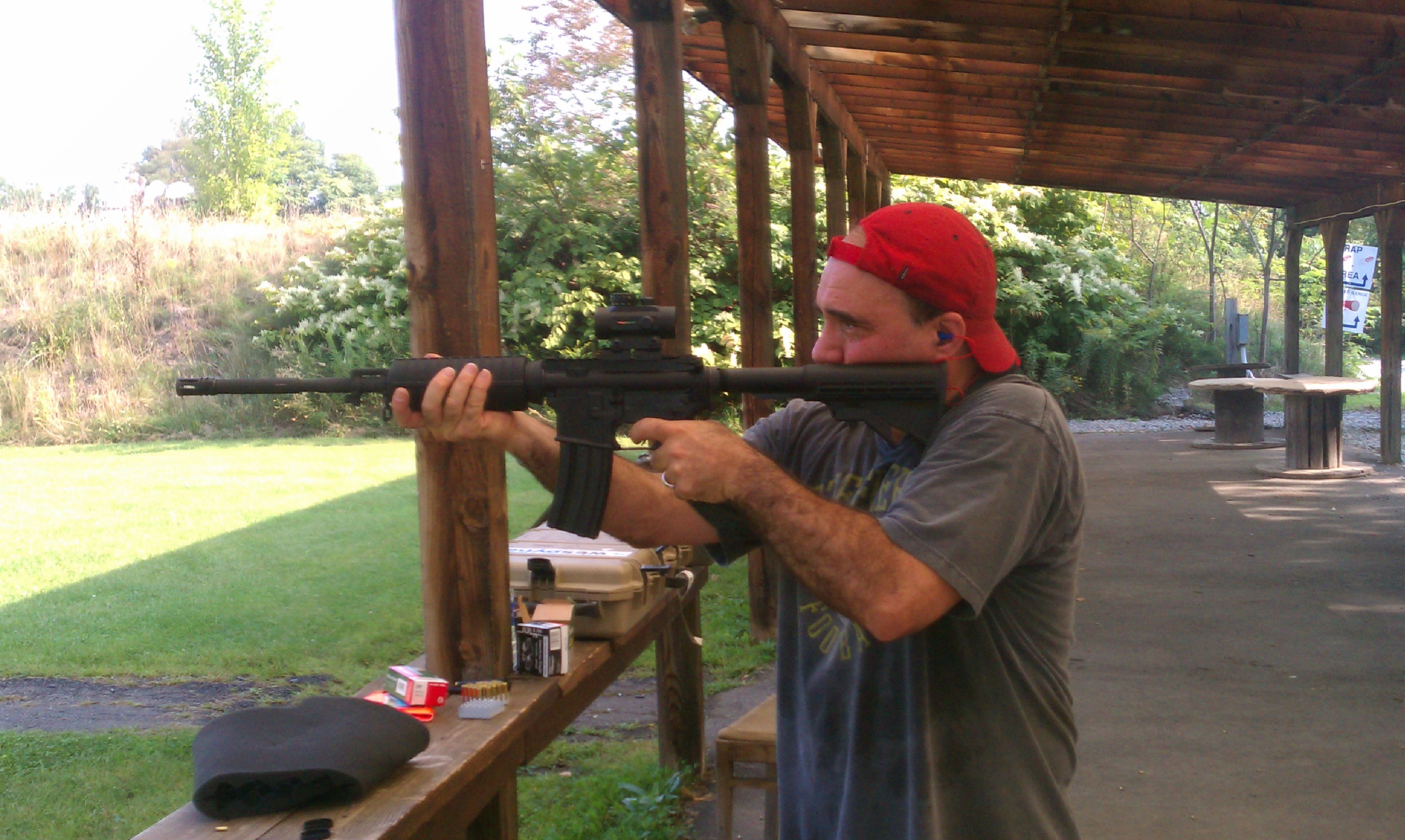 On the range with an AR 15 rifle.
