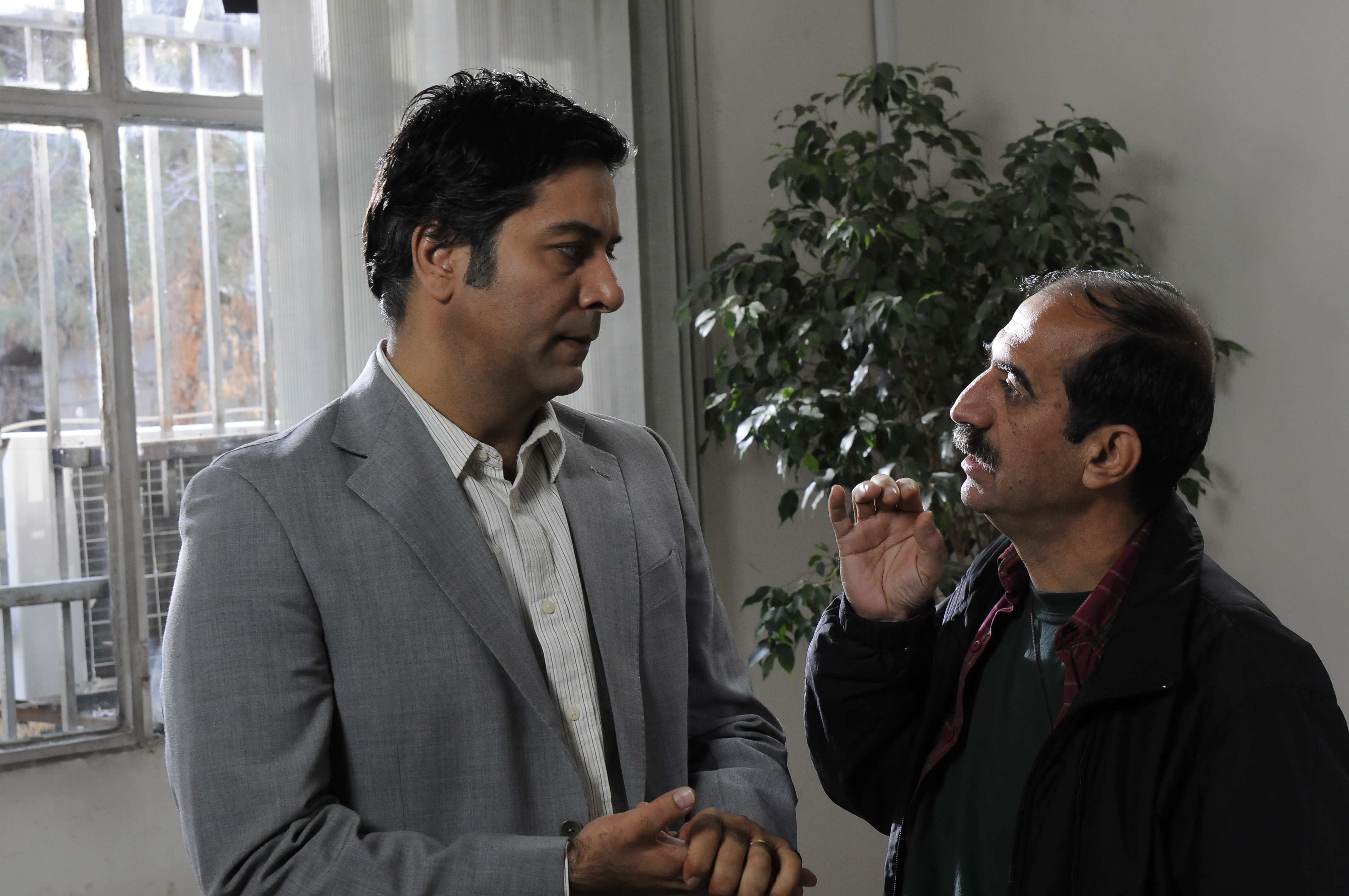 with Hamidreza Peghah in a scene of A Very Close Encounter