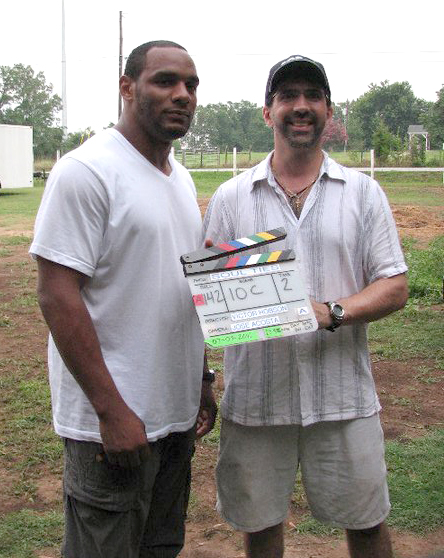Jose presents director Victor Hobson with the slate from Soul Ties.