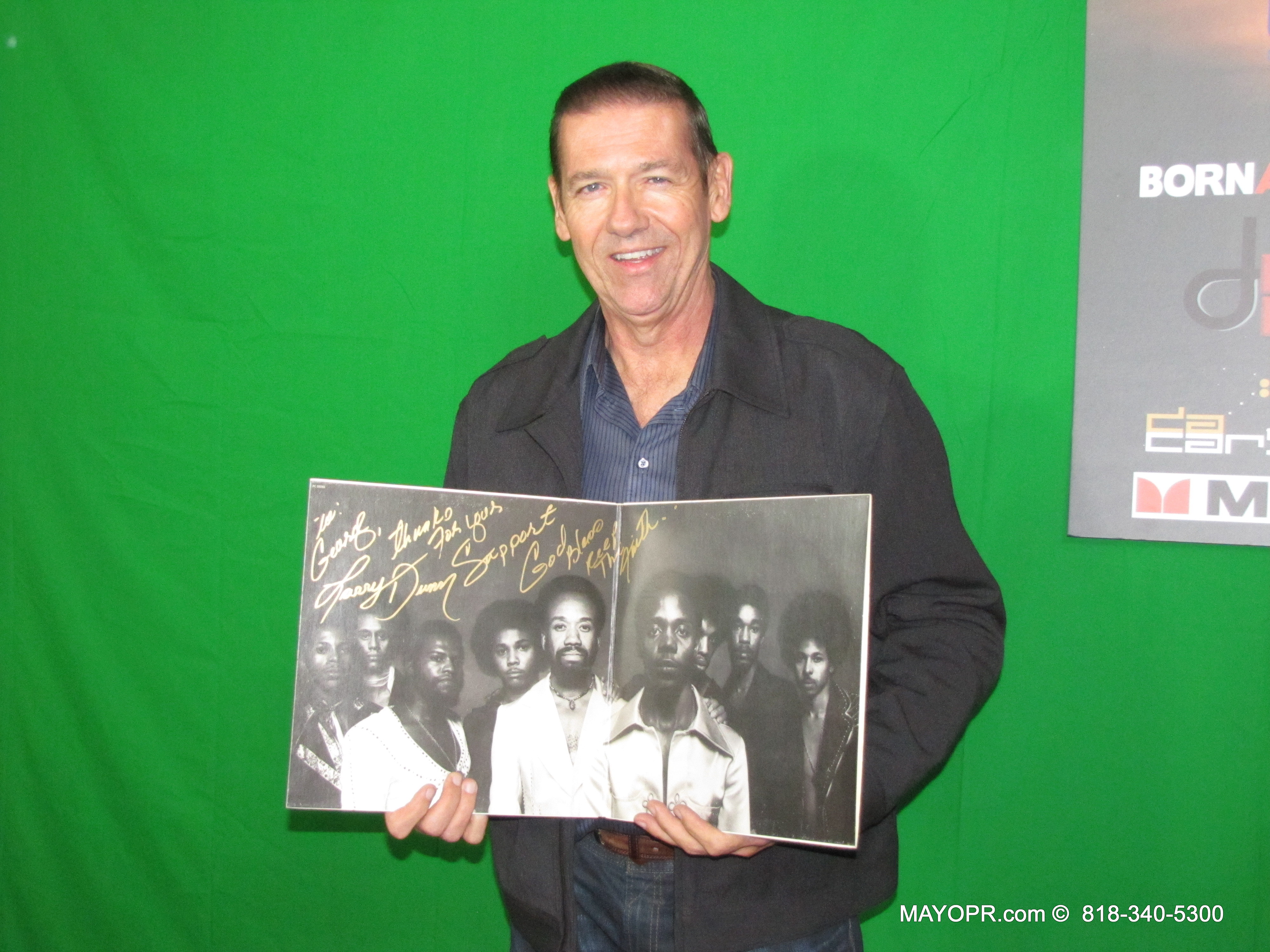 George S. McQuade III holds up his just autographed Earth, Wind & Fire Album with EWF's former keyboardist Larry Dunn,who performed with Jon Barnes, Theresa King, Luis Montilla, Carlos Sanchez and other Jazz Giants at the Catalina Jazz Club