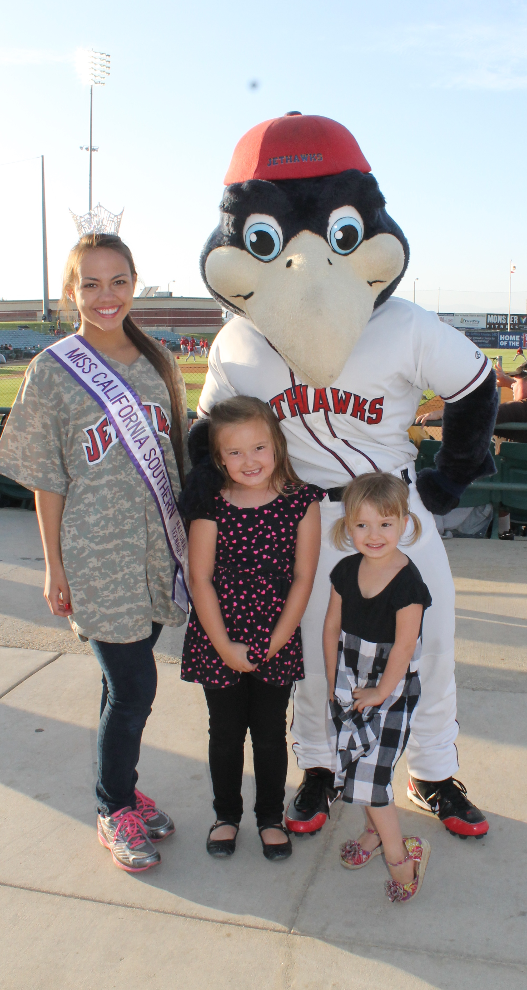 Miss California Southern National Teenager posing with KaBoom and kids