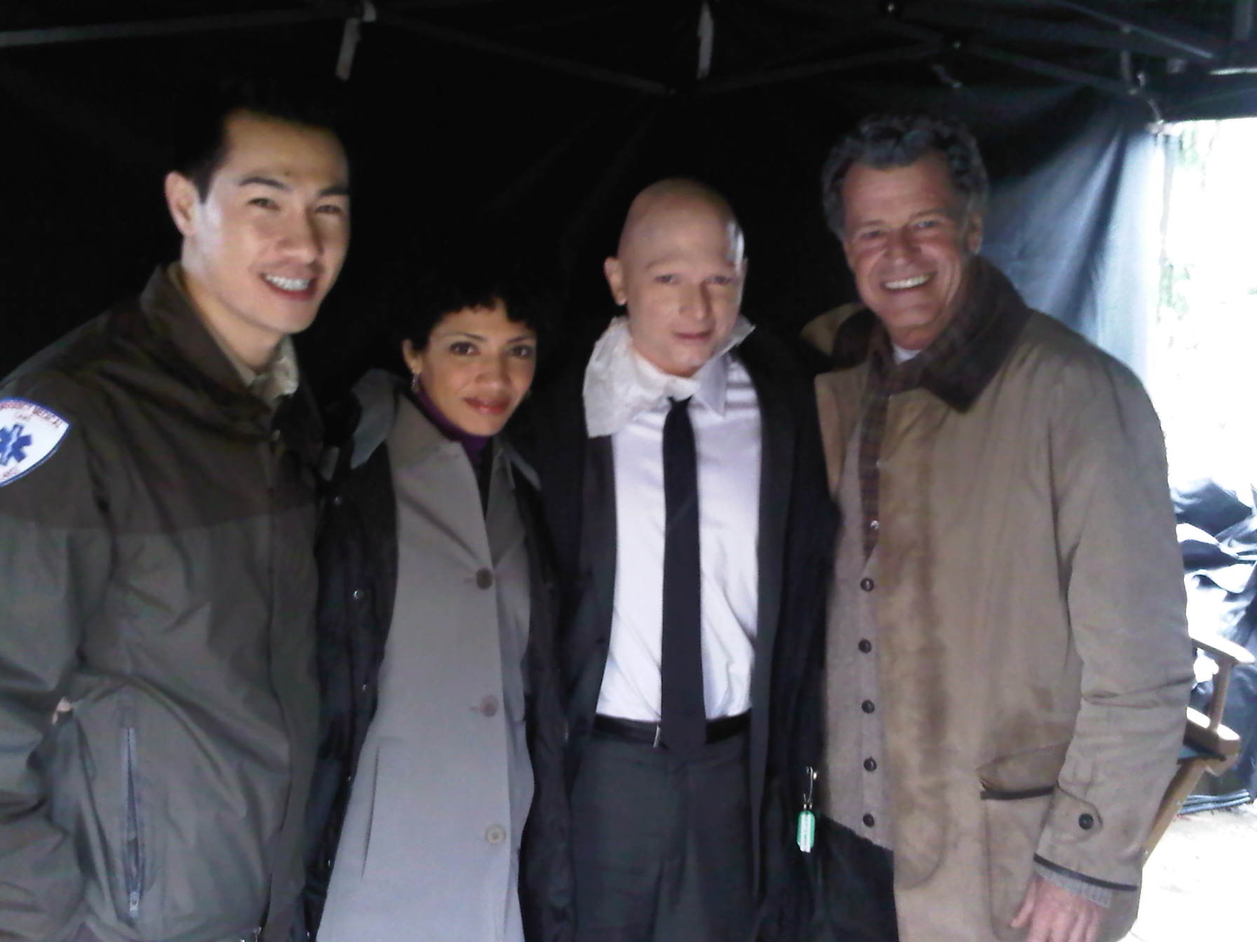 Owen Kwong, Jasika Nicole, Michael Cerveris and John Noble on the set of Fringe.