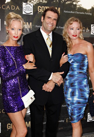Eva Fahler, Extra host Jerry Penacoli, and Mia Fahler attend the 2011 Skin Cancer Foundation's 'A Night The Stars Shine On' at the Central Park Zoo on June 28, 2011 in New York City.