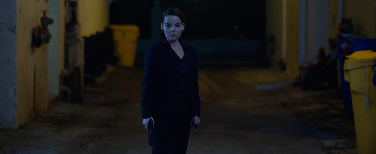 Agent Wilburn (Keri Maletto) in So Dark.