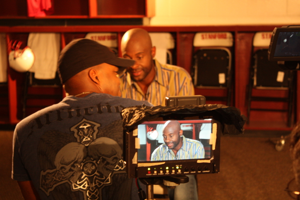 Producer Andre Gordon with host Jerry Rice on the set of 