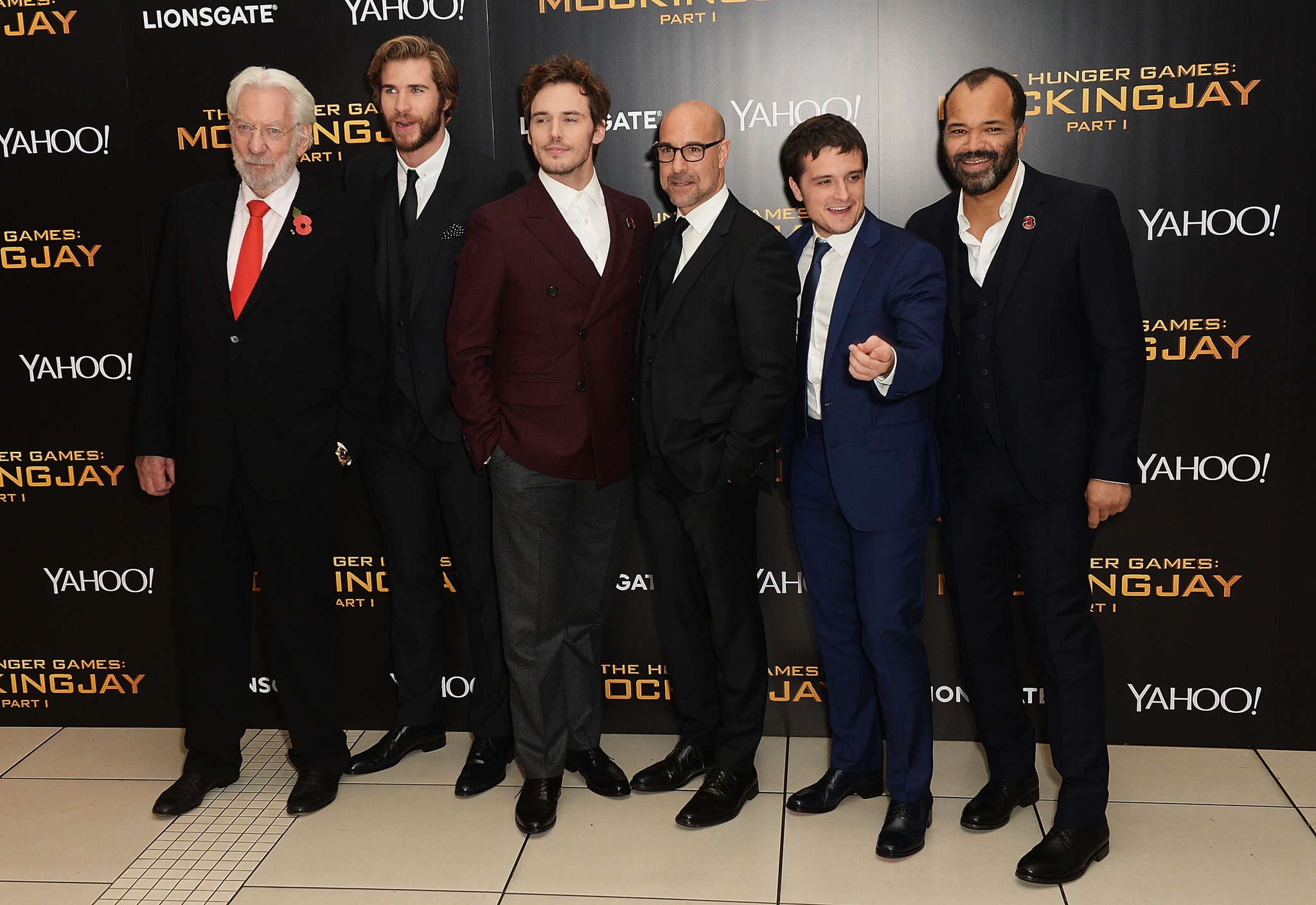 Donald Sutherland, Stanley Tucci, Jeffrey Wright, Josh Hutcherson, Liam Hemsworth and Sam Claflin at event of Bado zaidynes: Strazdas giesmininkas. 1 dalis (2014)