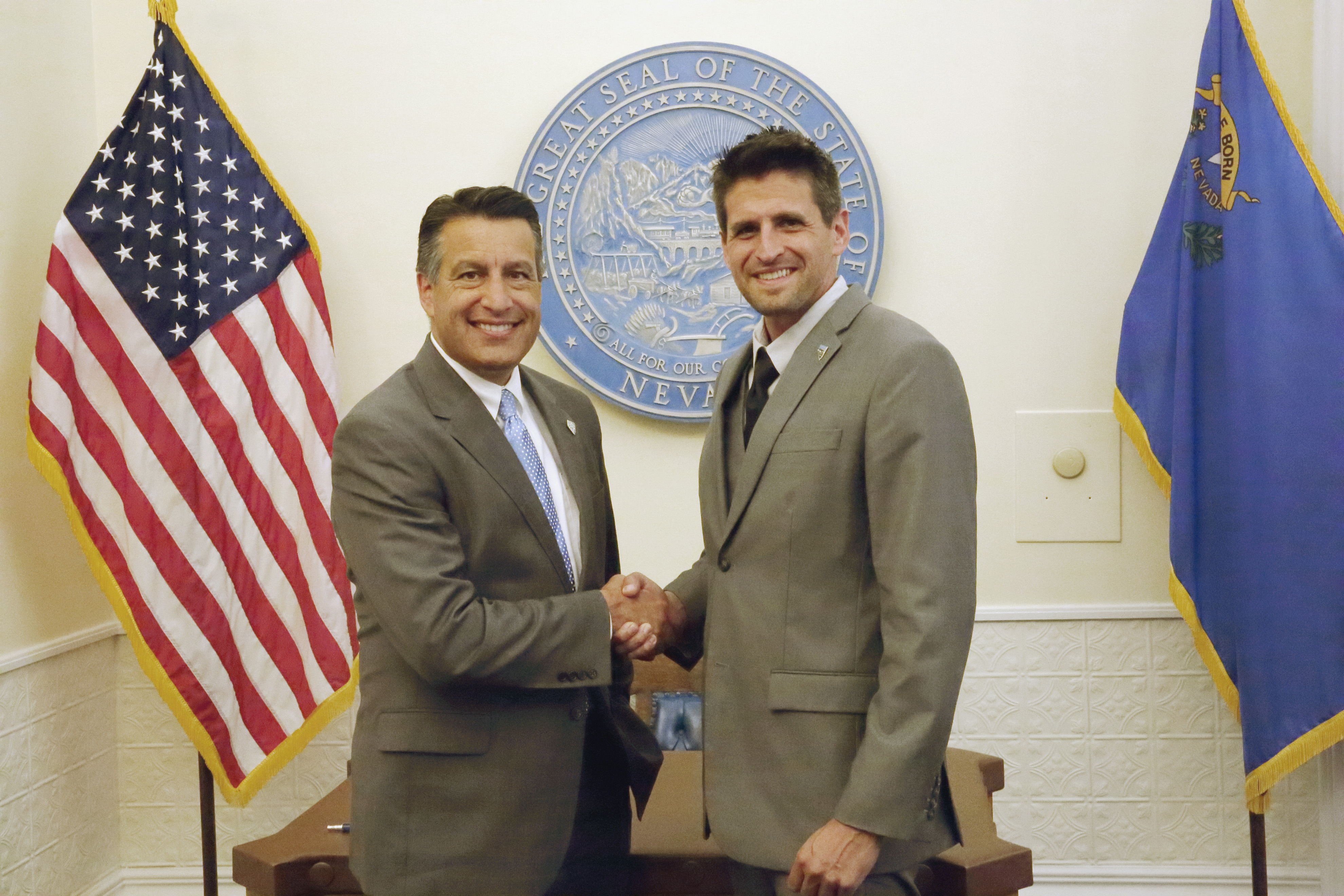 With Gov. Brian Sandoval at the signing of Nevada's film tax credit legislation.