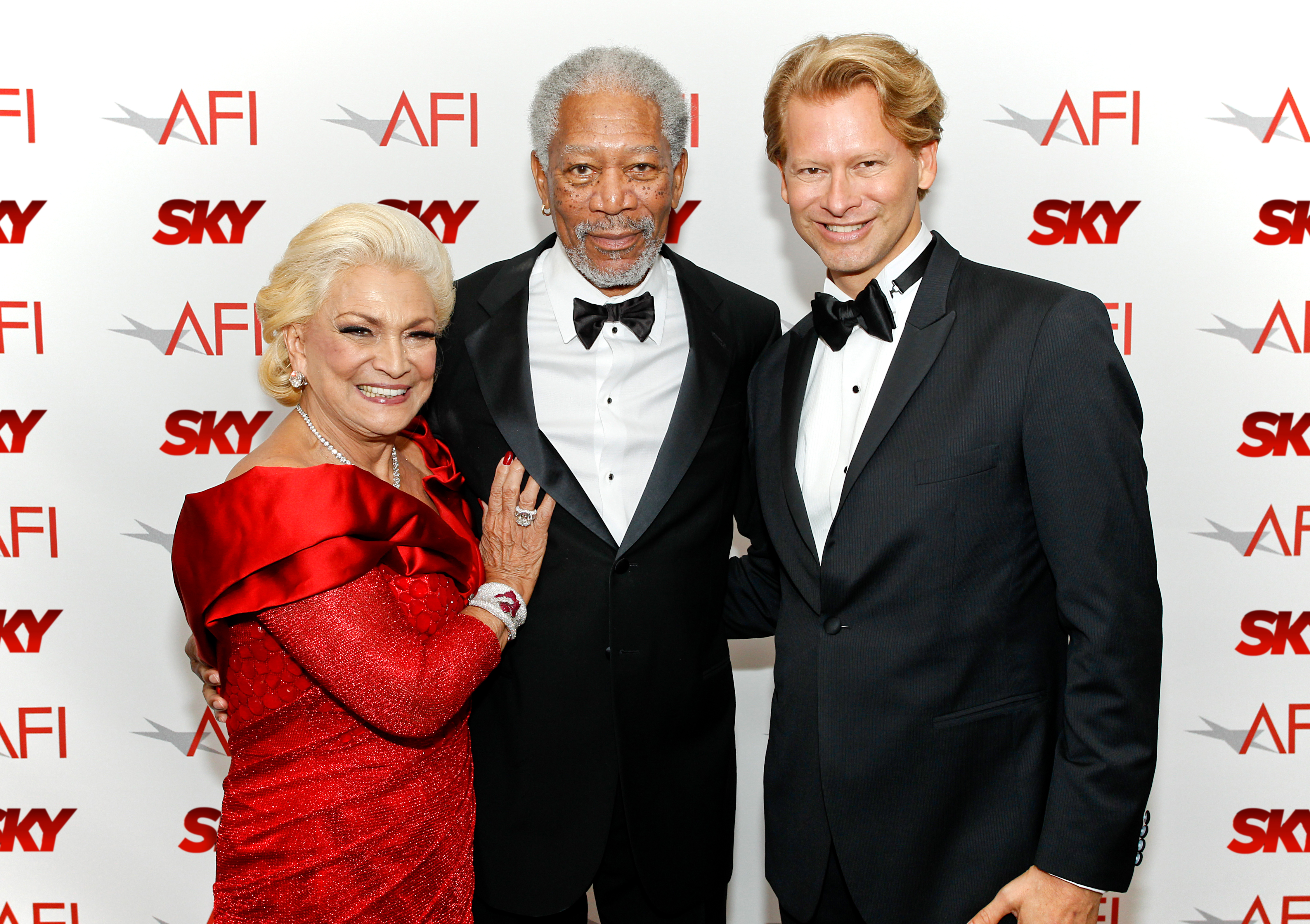 Marcello Coltro and his special guest Hebe Camargo meet with Morgan Freeman at the 39th AFI Life Achievement Award in Los Angeles