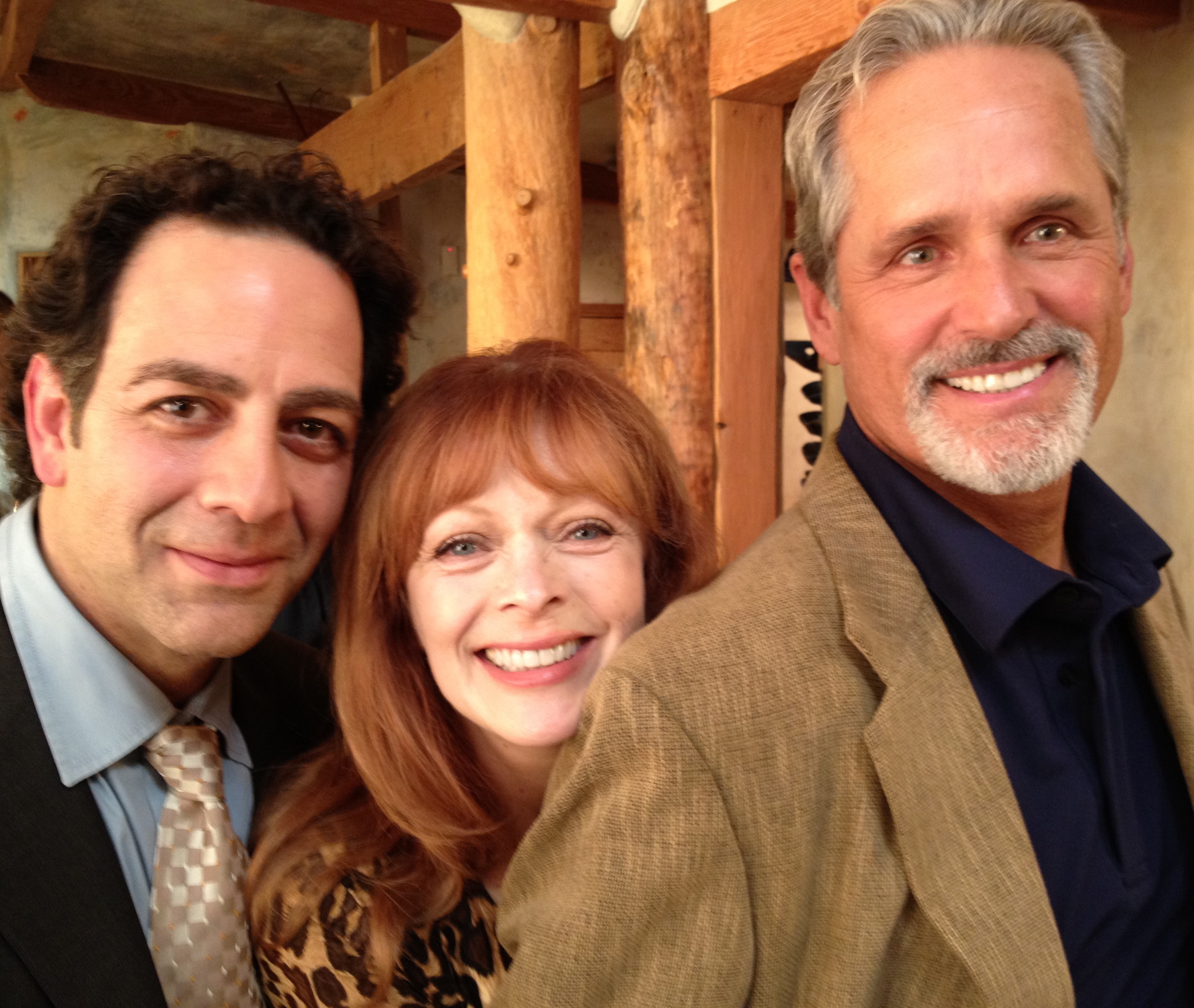 Robert Hallak, Francis Fisher and Gregory Harrison on the set of 