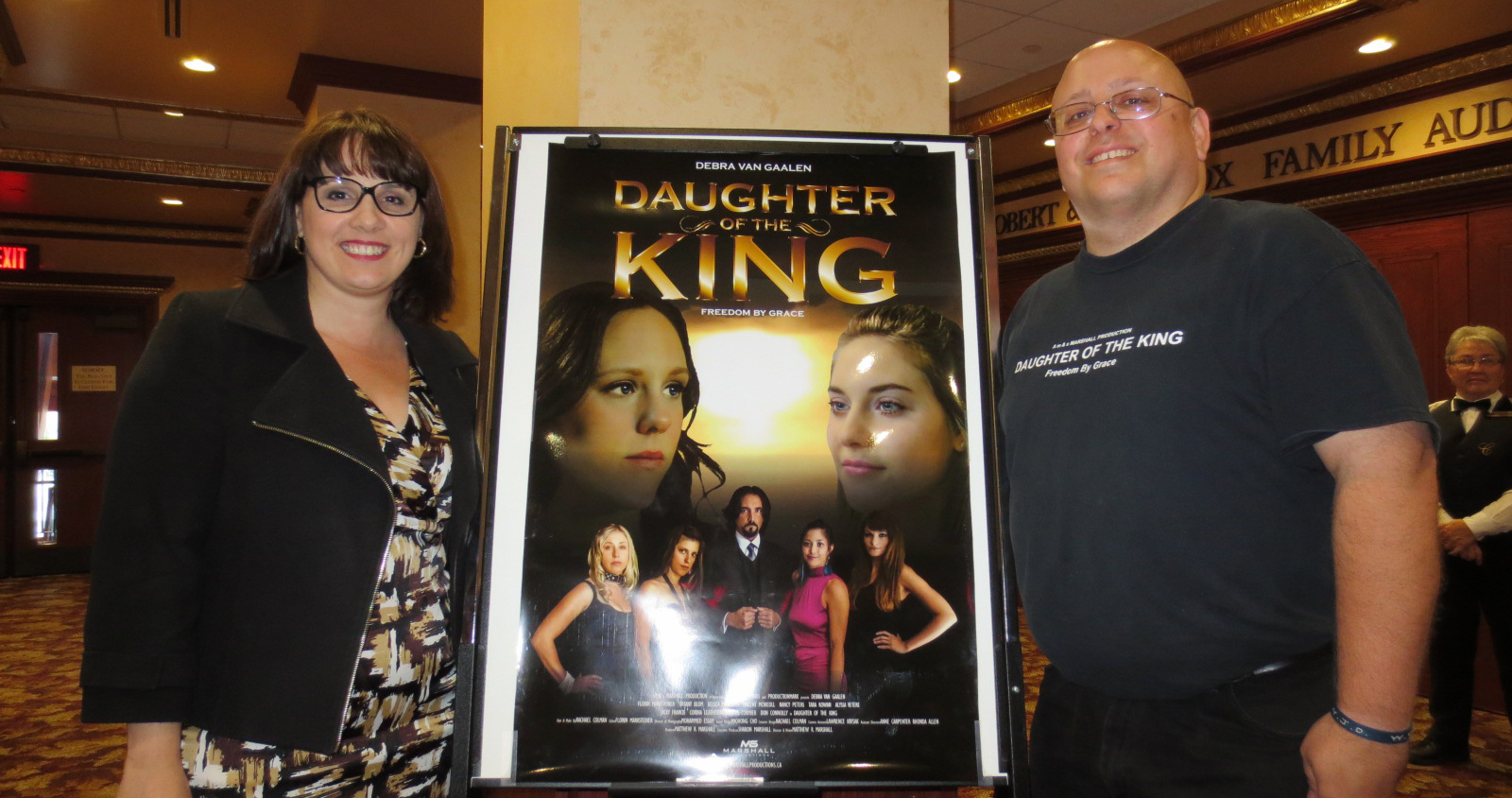 Angela Corso, program manager of the Chatham-Kent Women's Centre, and director Matthew Marshall pose by a poster of his film, Daughter of the King. The CKWC and Marshall presented a hometown screening with proceeds going to CKWC.