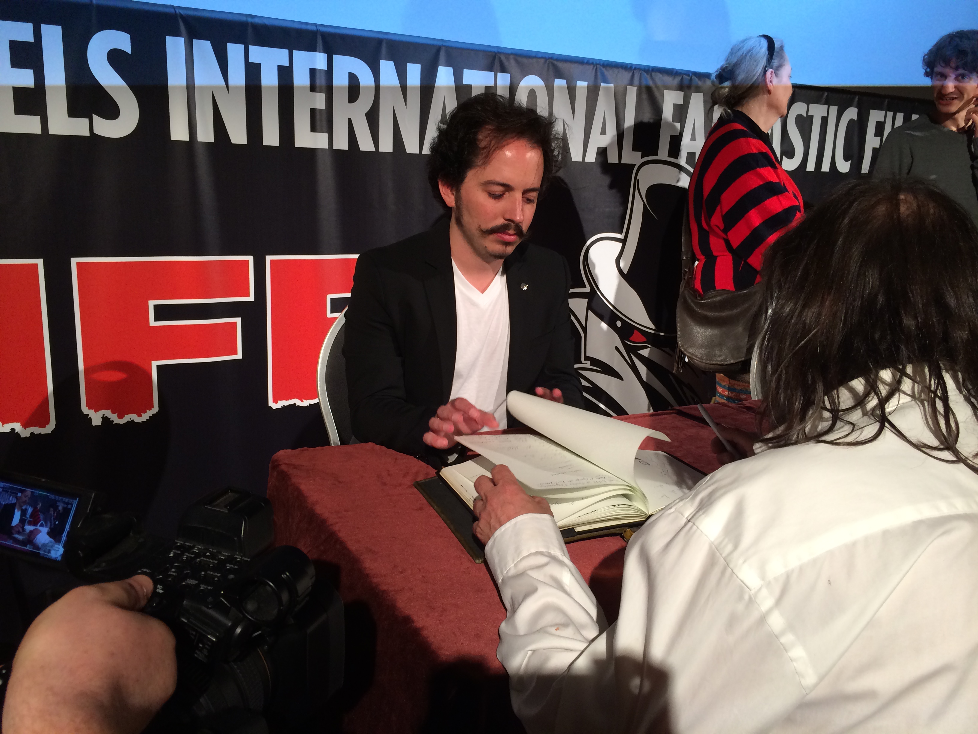 Isaac Ezban signing autographs after the screening of THE INCIDENT at BIFFF (Brussels International Fantastic Film Festival), April 2015