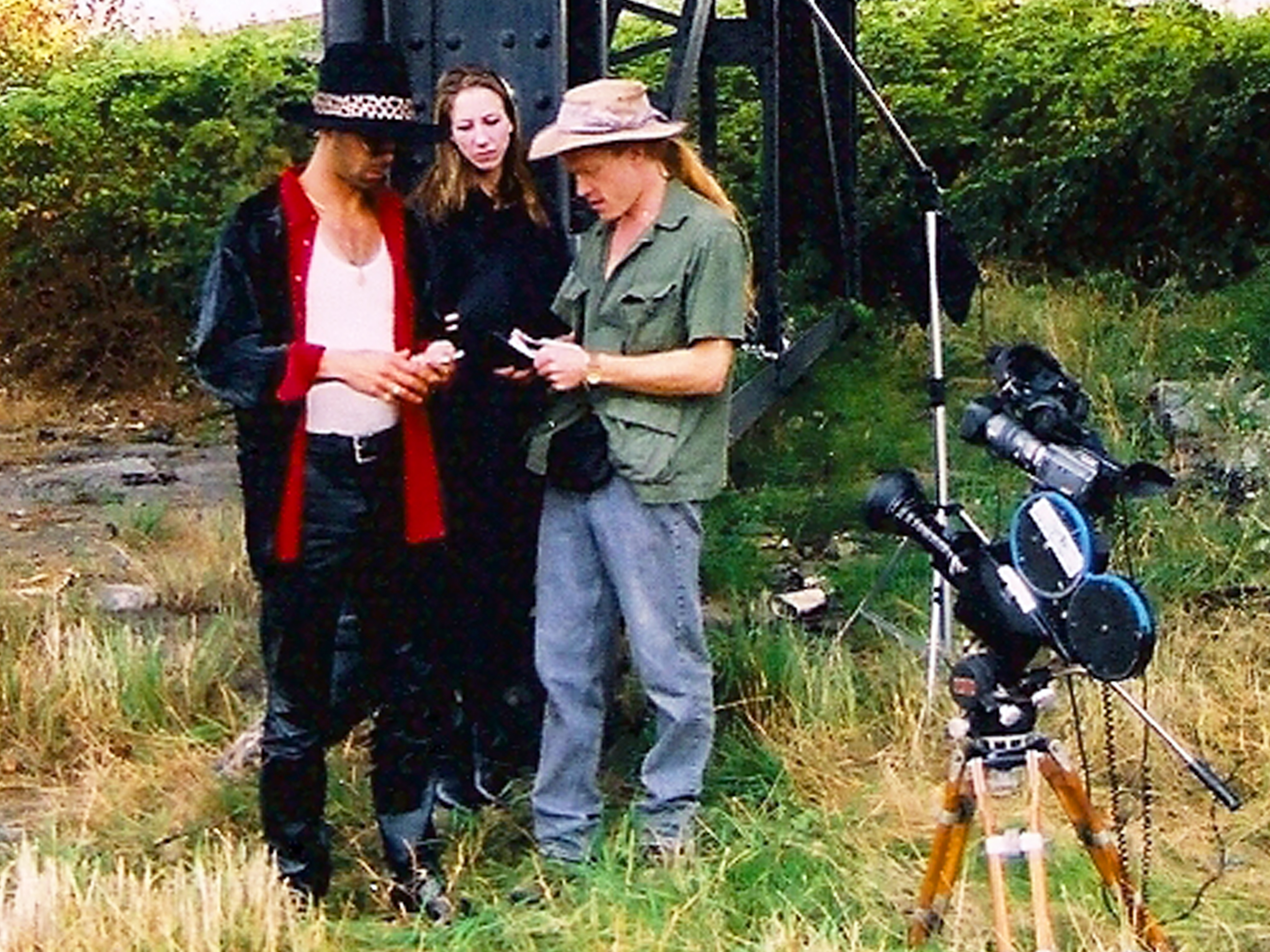 HT directs Pimp & Hooker scene for Vancouver Vagabond, 2002. Old and new school filmmaking: CP16mm with DV camera mounted with frames matched for replay and behind the scenes taping of scene.