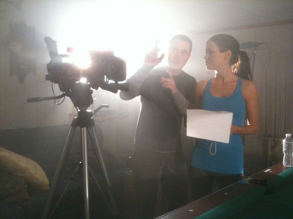 Ali Costello receiving direction from director Derek Wayne Johnson on the set of 