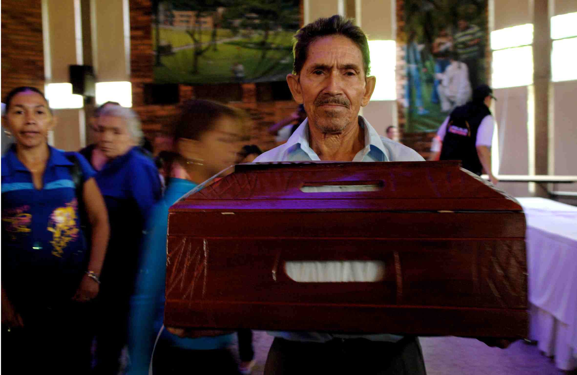 Colombia- one man finally gets to bury his son.